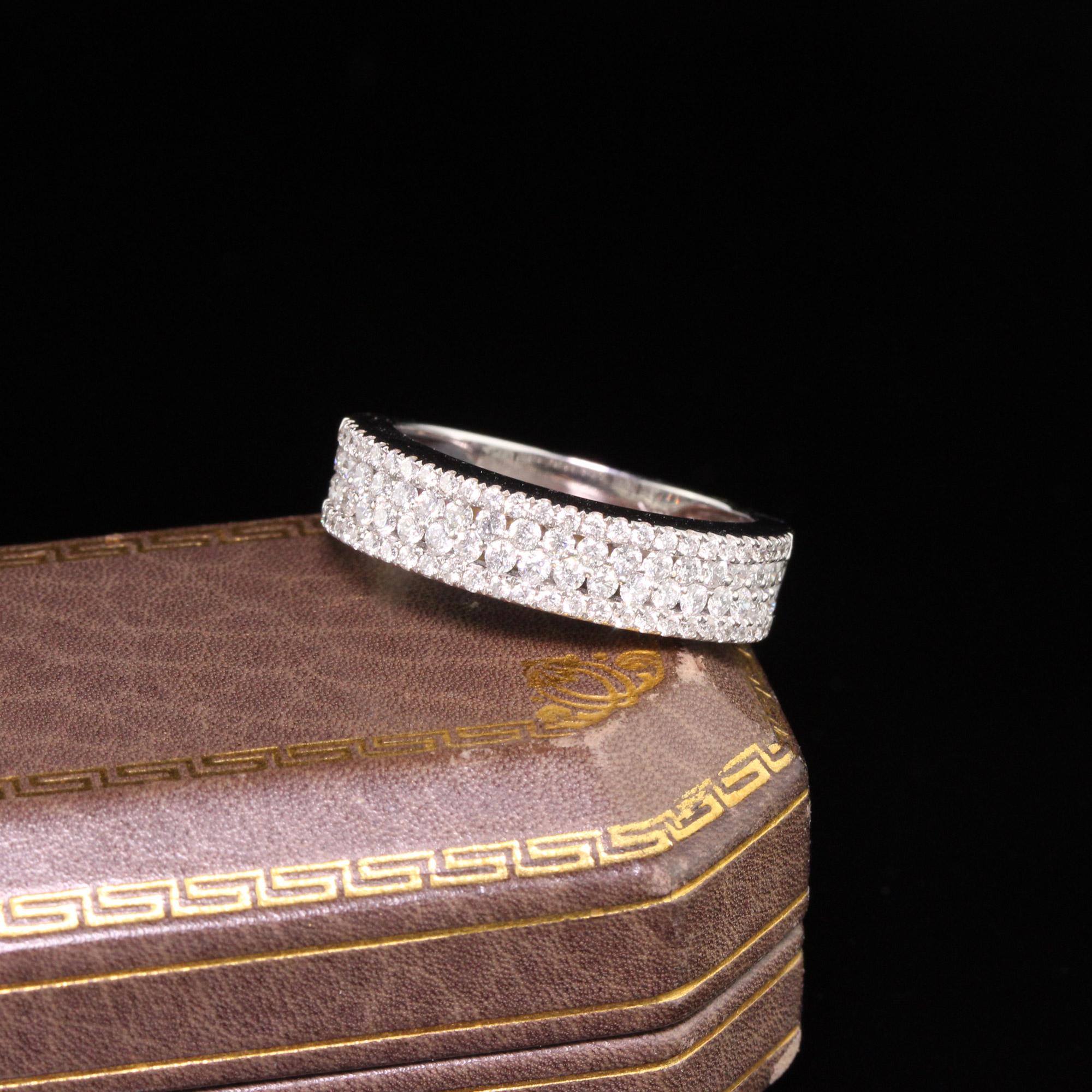 Dazzling four-row diamond band with white gold mounting  

Metal: White Gold

Weight: 4.8 Grams

Total Diamond Weight: Approximately 1 ct

Diamond Color: H

Diamond Clarity: VS2

Ring Size: 7 (sizeable)

Measurements: 5.3 x 3.6 mm