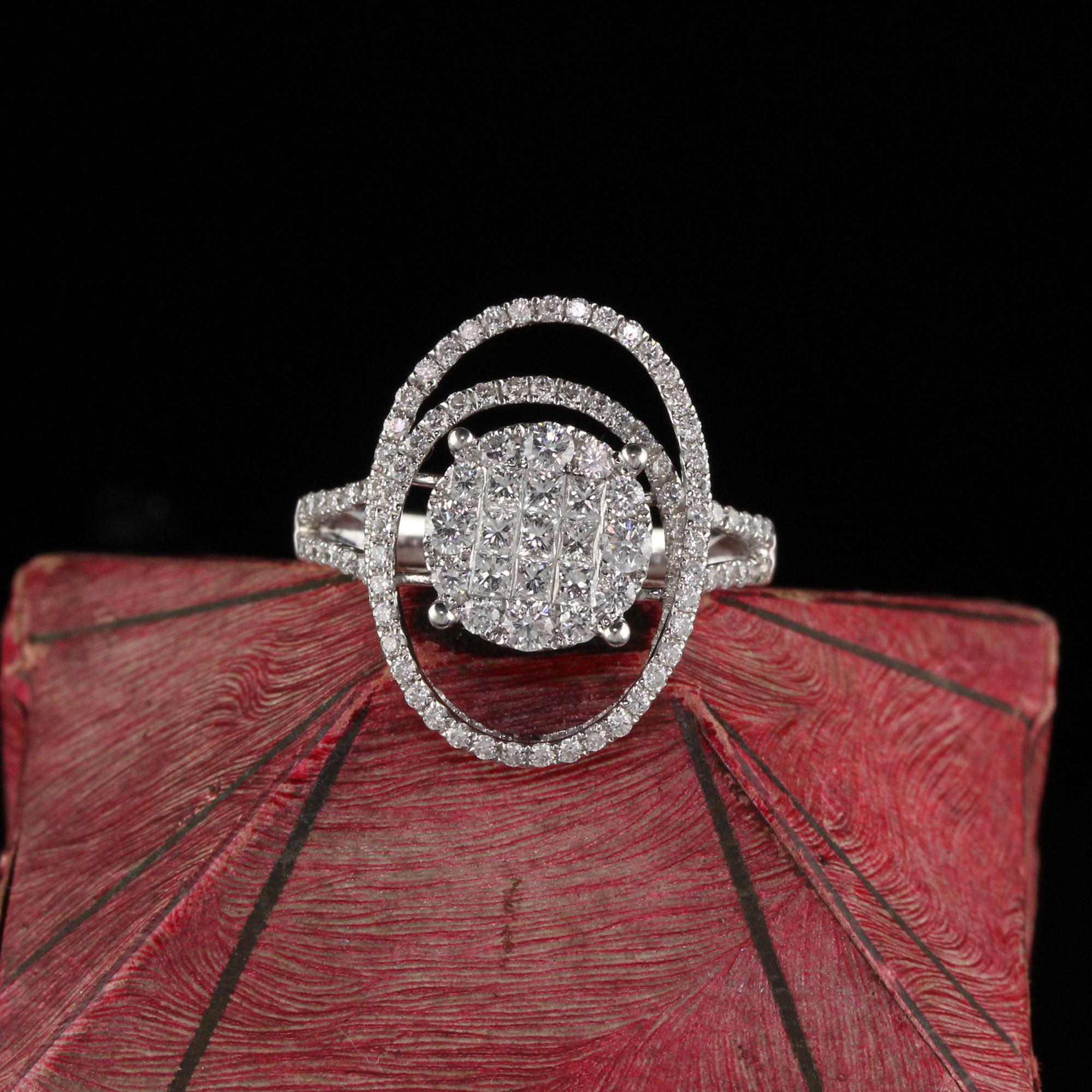 Elegant and beautifully designed diamond ring with cluster style center.

Metal: 14K White Gold

Weight: 4.0 Grams

Total Diamond Weight: Approximately 1.10 ct.

Diamond Color: H

Diamond Clarity: VS2

Ring Size: 6.25 (sizable)

Measurements: 19.35
