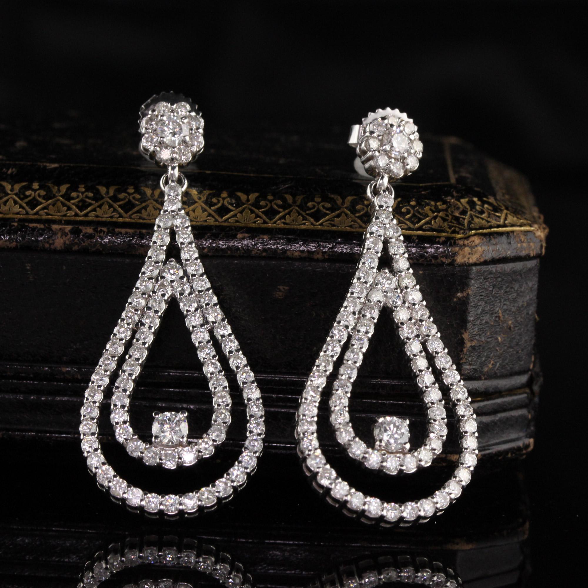 Stunning and elegant diamond drop earrings.

Metal: 14K White Gold

Weight: 9.9 Grams

Diamond Weight: Approx. 4 ct

Diamond Color: H

Diamond Clarity: SI1

Measurements: 44.85 x 18.74 mm