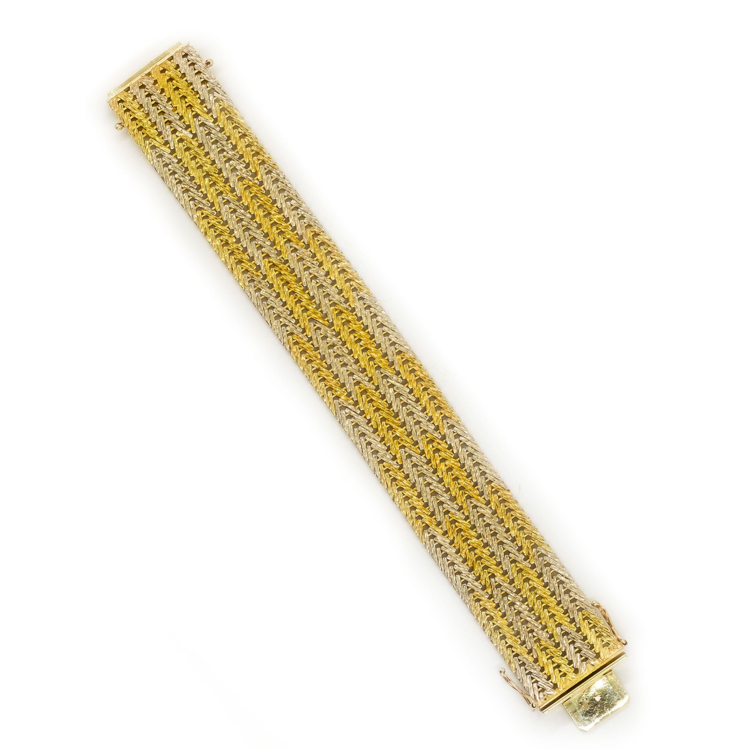 ESTATE 14K YELLOW AND WHITE GOLD TEXTURED BAR-LINK FLEXIBLE STRAP BRACELET
Circa mid-20th century  68.5 grams total weight  6 3/4