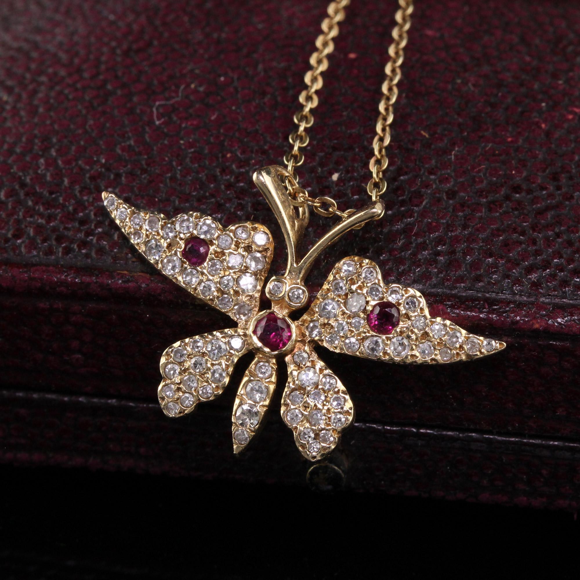 Beautiful Vintage Estate 14K Yellow Gold Diamond and Ruby Butterfly Pendant Necklace. This beautiful necklace is crafted in 14k yellow gold. The pendant features white single cut diamonds on the entire butterfly and natural rubies to accent the body