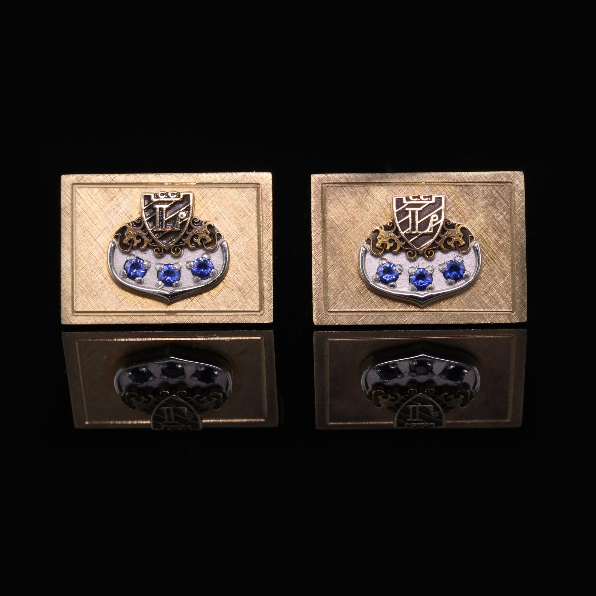 Very cool 14K yellow gold estate cufflinks with 'L' initial emblem, black enamel, and blue sapphires.

Metal: 14K Yellow Gold

Weight: 18 grams

Measurement: The cufflinks measures 22 mm wide and 16 mm high.