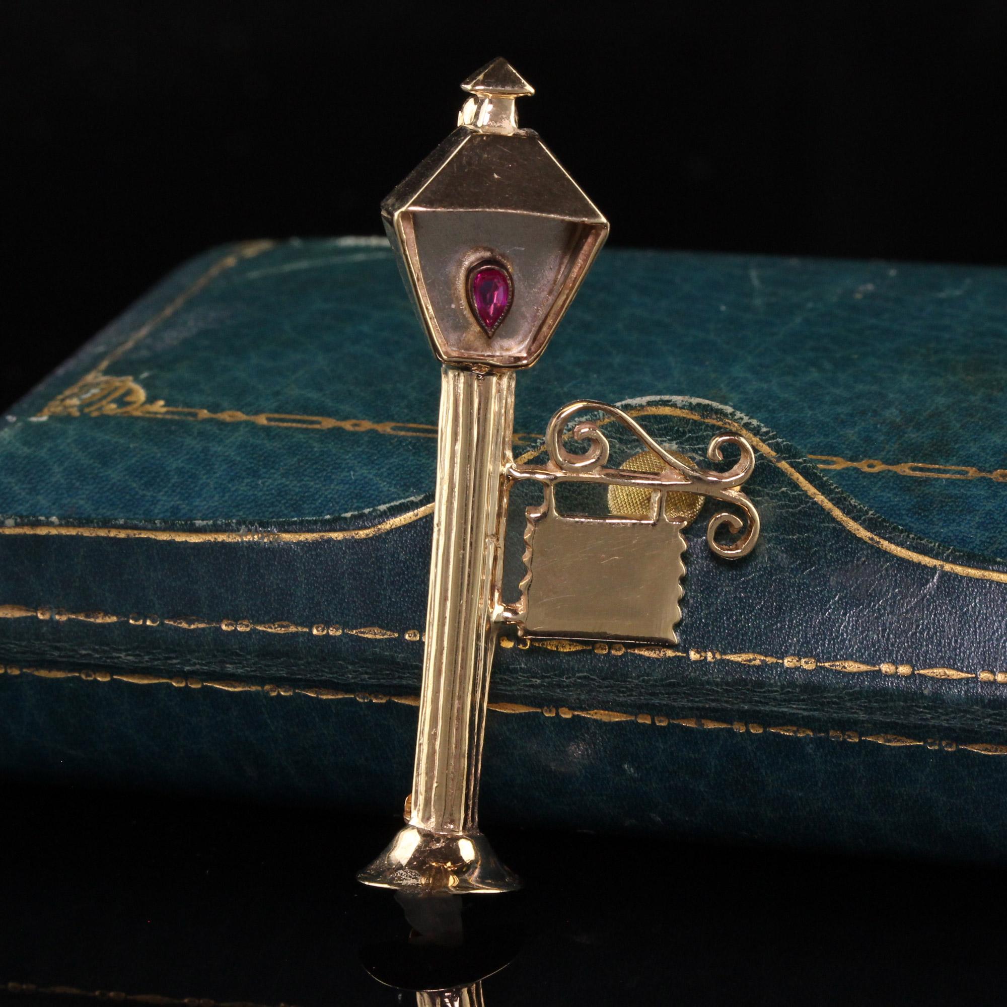 Beautiful Vintage Estate 14K Yellow Gold English Lamp Post Ruby Pin. This amazing pin is crafted in 14k yellow gold. This incredible piece has a natural pear shape ruby in the lamp that is the fire and is crafted beautifully.

Item #P0146

Metal: