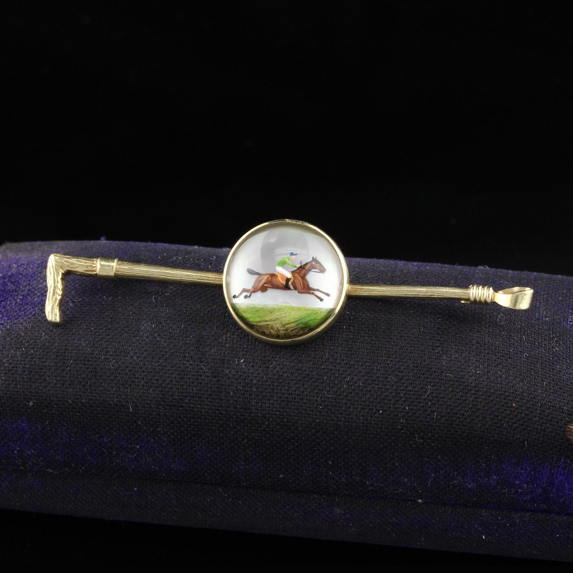 Vintage estate equestrian / jockey reverse crystal bar brooch.

Metal: 14K Yellow Gold

Weight: 5.2 Grams 

Measurements: 15 x 58 mm