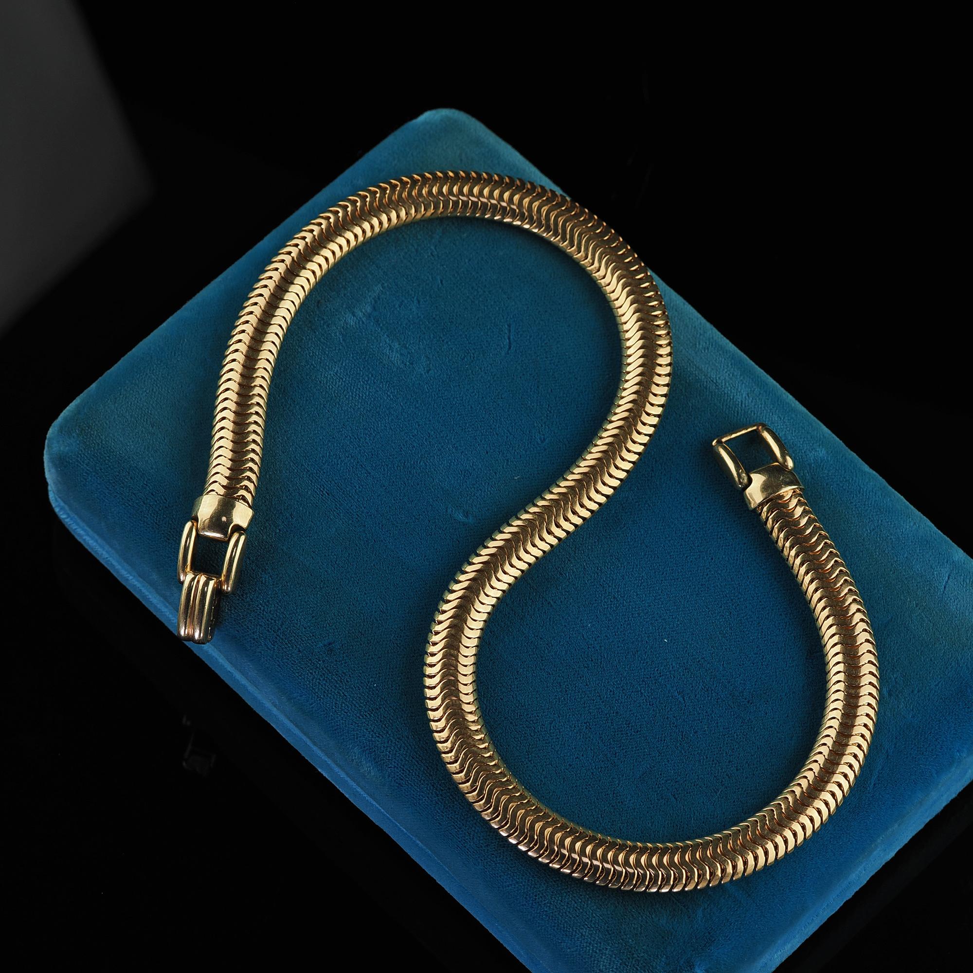 Beautiful Vintage Estate 14K Yellow Gold Thick Wide Snake Chain - 15 3/4 inches. This gorgeous vintage estate wide snake chain is crafted in 14k yellow gold. This gorgeous necklace features a beautiful wide snake pattern going across the entire