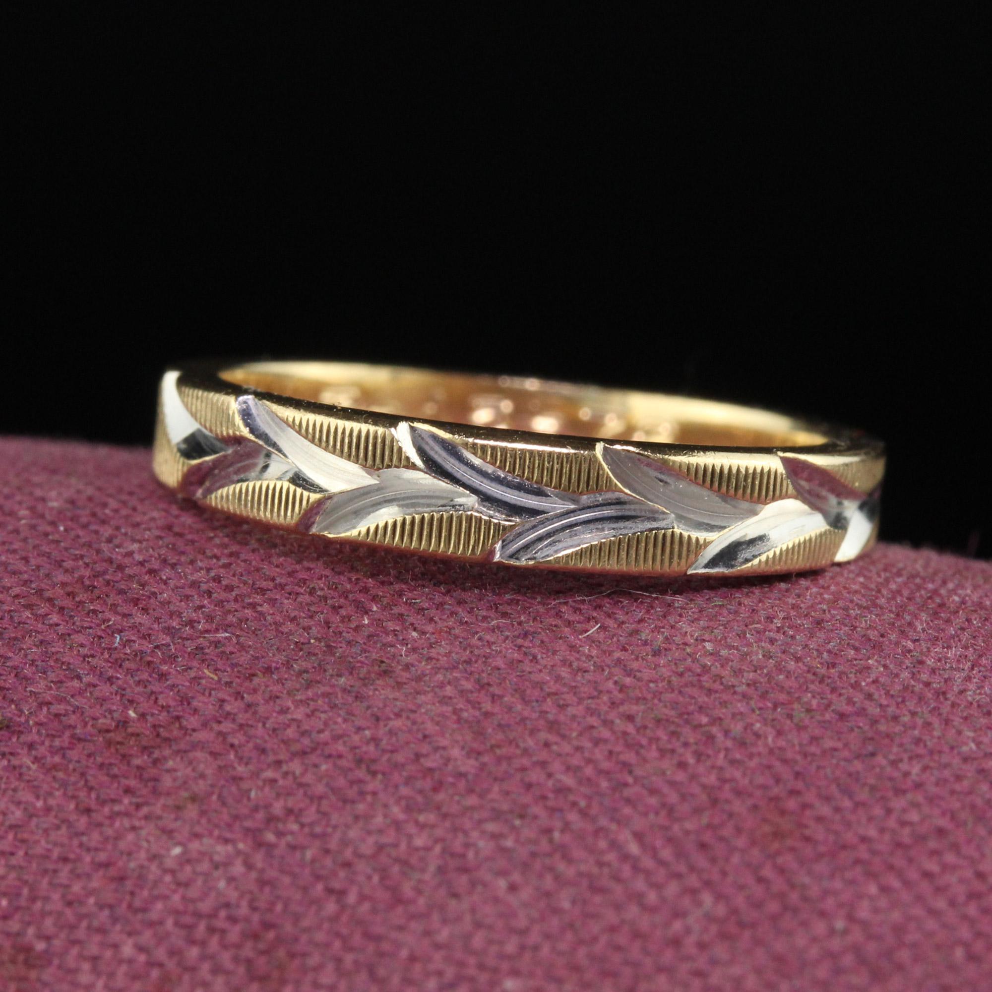 Beautiful Vintage Estate 14K Yellow Gold Two Tone Engraved Floral Wedding Band - Size 5 1/4. This beautiful wedding band is crafted in 14k yellow gold and white gold top. The ring has a deeply engraved design on top of the ring and has 