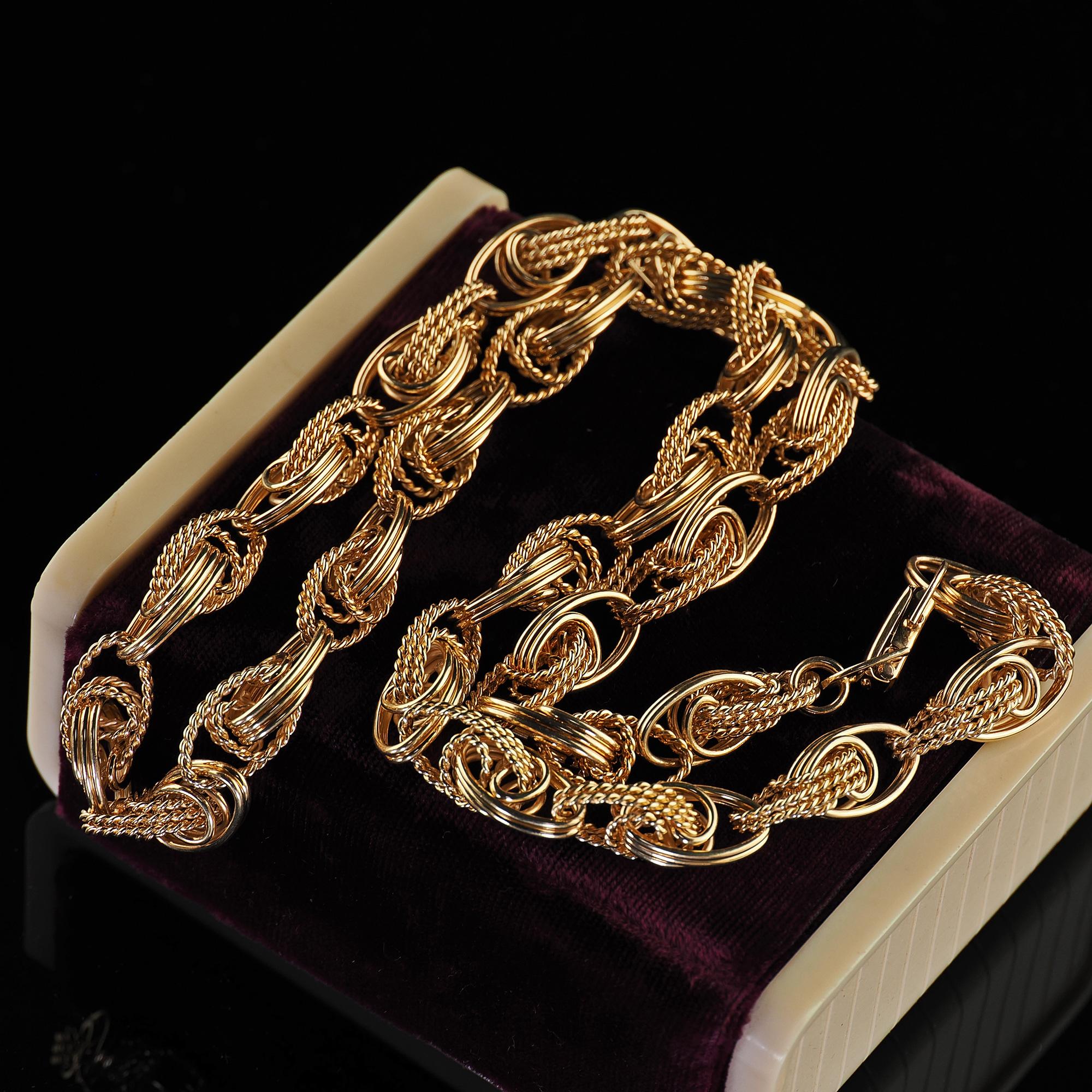 Beautiful Vintage Estate 14K Yellow Gold Wide Twisted Link Necklace - 26 inches. This gorgeous vintage estate twisted necklace is crafted in 14k yellow gold. This beautiful necklace features customer handmade twisted links connected around the