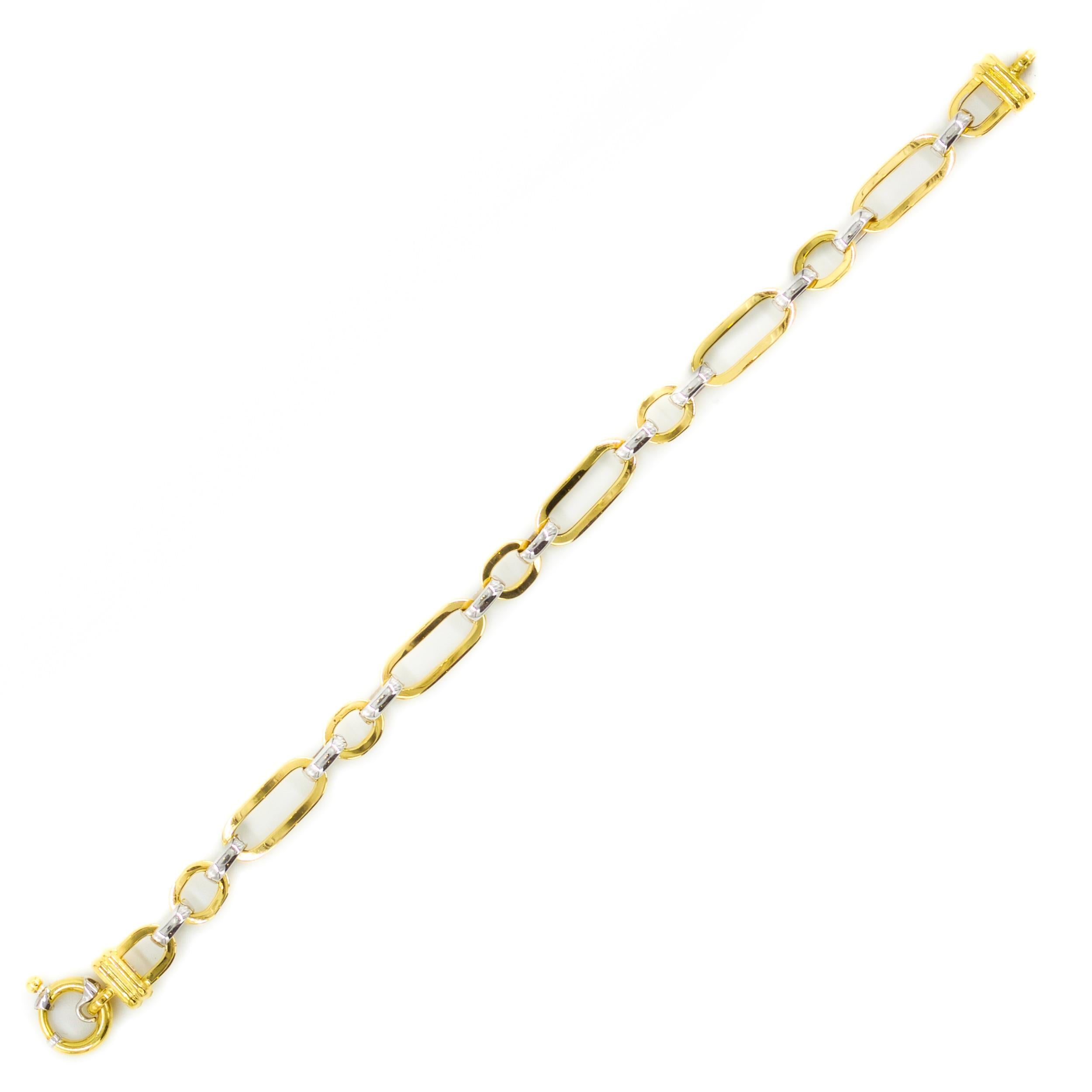 A fun and playful everyday bracelet by OTC, this lovely vintage piece features oval and circular 18 karat yellow gold hollow links attached with high-polish 18 karat white gold hollow circular rings. It locks together with a circular spring-ring