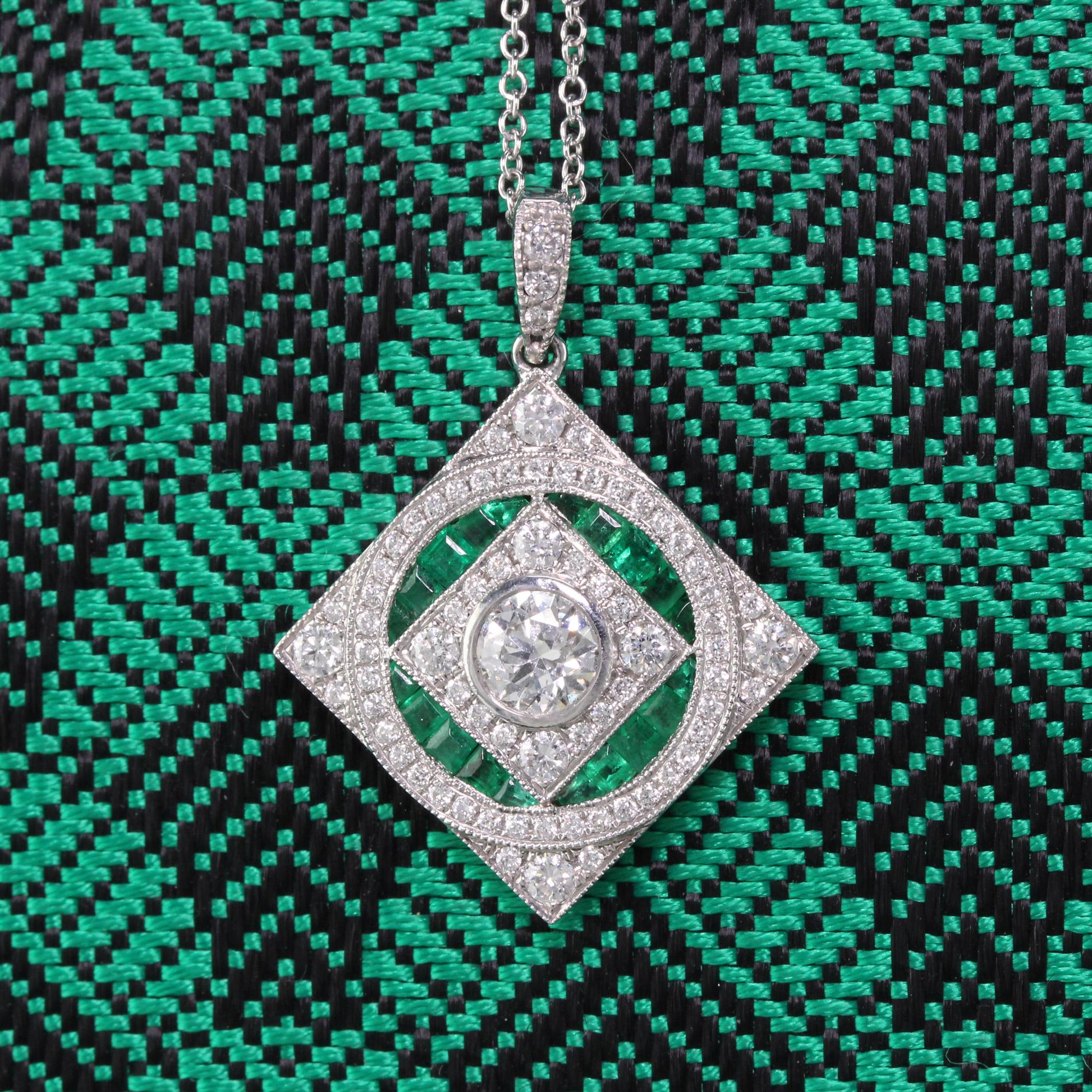 Gorgeous emerald and diamond pendant with dazzling diamond center.

Metal: 18K White Gold

Weight: 5.2 Grams

Diamond Weight: Approximately 1 ct.

Diamond Color: G

Diamond Clarity: VS2

Gemstone Weight: Approximately 0.70 ct. emerald

Measurements: