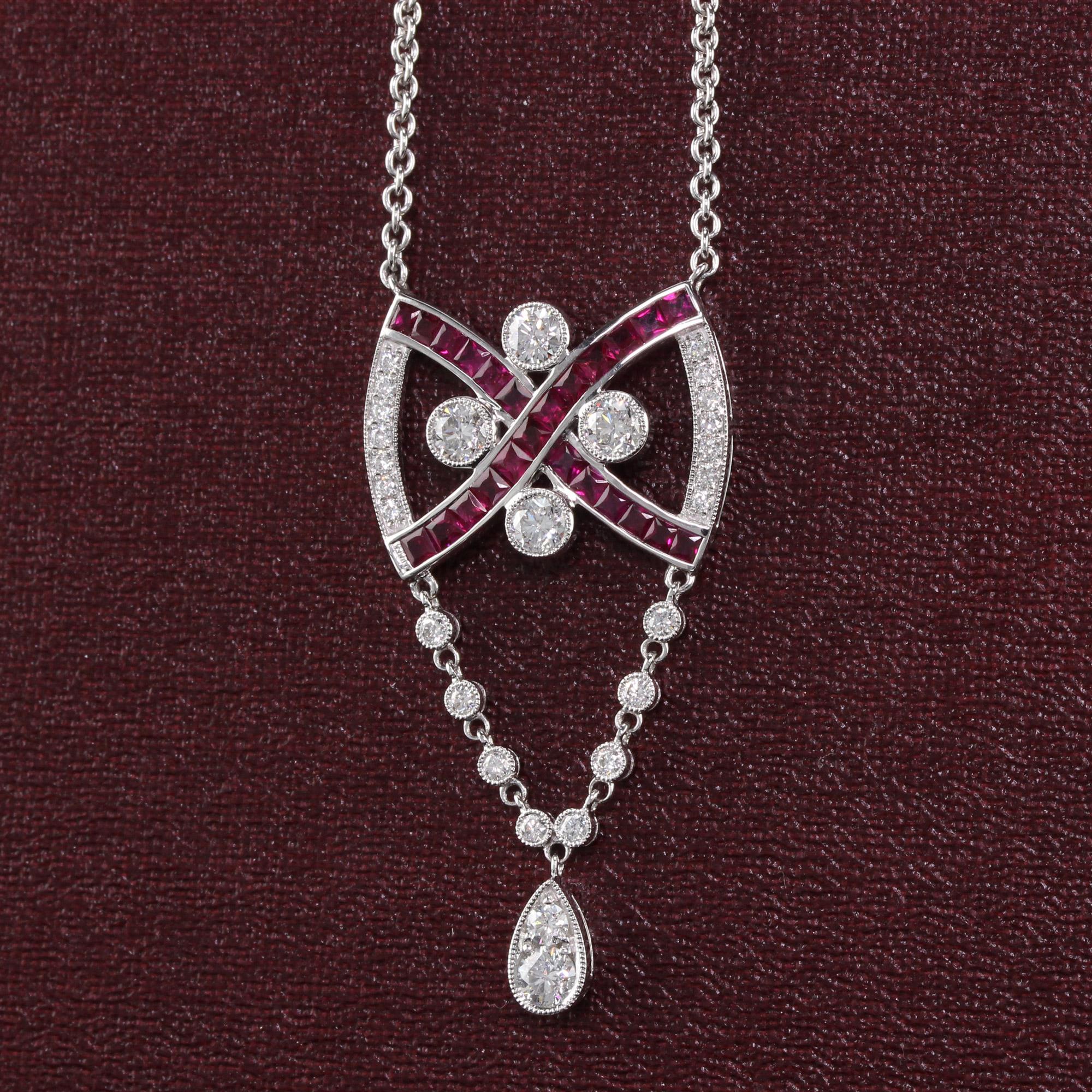 Gorgeous ruby and diamond pendant.

Metal: 18K White Gold

Weight: 11.3 Grams

Diamond Weight: Approximately 1.50 ct.

Diamond Color: G

Diamond Clarity: VS2

Gemstone Weight: Approximately 2 ct. ruby

Measurements: Pendant measures 23.12 x 44.59