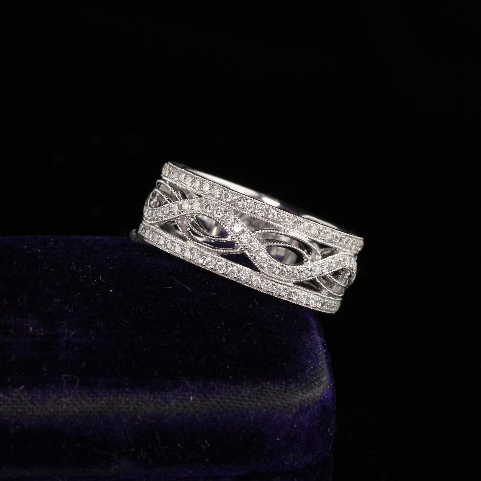 Elaborate white gold diamond band

Metal: White Gold

Weight: 6.4 Grams

Total Diamond Weight: Approximately 0.85 cts

Diamond Color: H

Diamond Clarity: SI1

Ring Size: 6.75 (sizable)

Measurements: 7.9 x 2.3 mm
