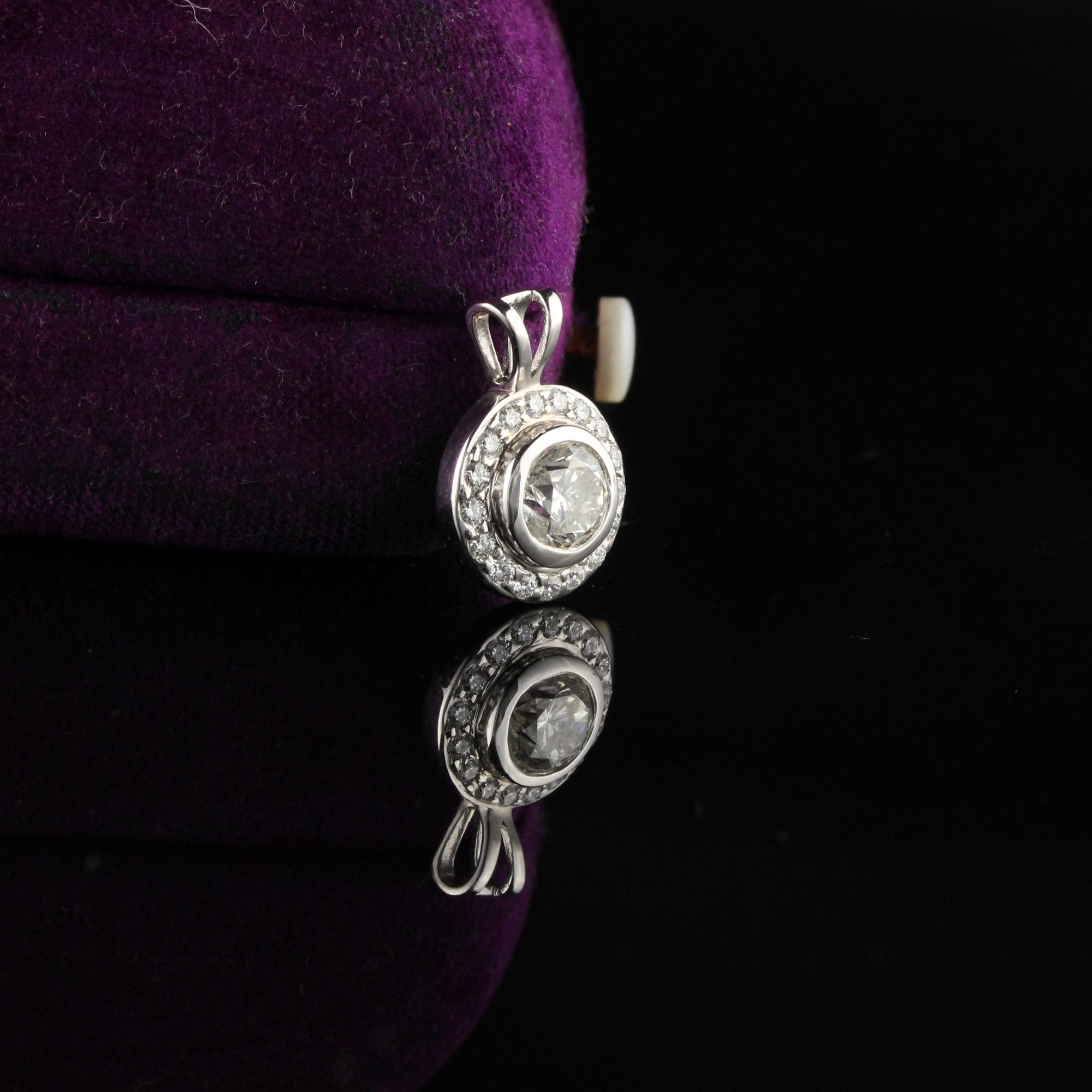 Dazzling and elegant circle shaped pendant with diamond center stone.

Metal: 18K White Gold

Weight: 1.9 Grams

Diamond Weight: Approximately 0.50 ct

Center Weight: Approximately 0.90 ct

Diamond Color: H

Diamond Clarity: SI1

Measurements: