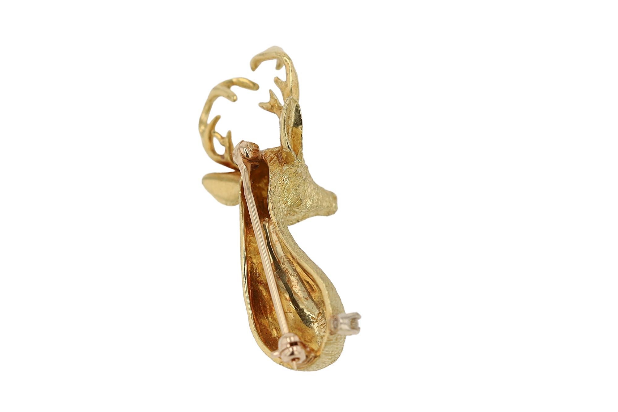 Add a touch of the outdoors to your wardrobe with this 18K deer pin. This  12 point buck is an en-deer-ing pin that comes alive with 2 pink sapphire eyes and finely textured gold resembling fur. This vintage estate brooch is a unique accessory and