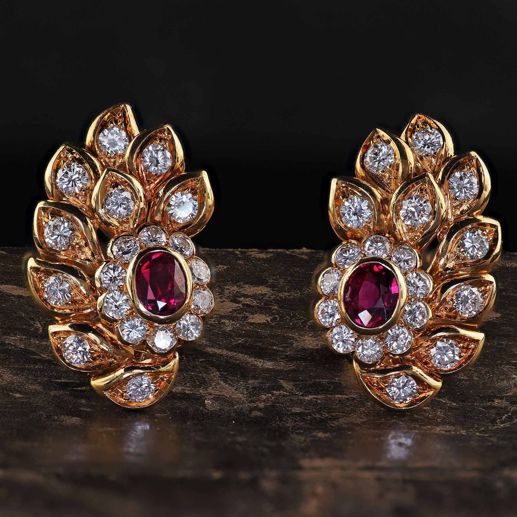 Beautiful Vintage Estate 18K Yellow Gold Diamond and Ruby Floral Clip On Earrings. This gorgeous pair of Vintage diamond and ruby earrings is crafted in 18k yellow gold. The earrings feature bright white round brilliant cut diamonds set throughout