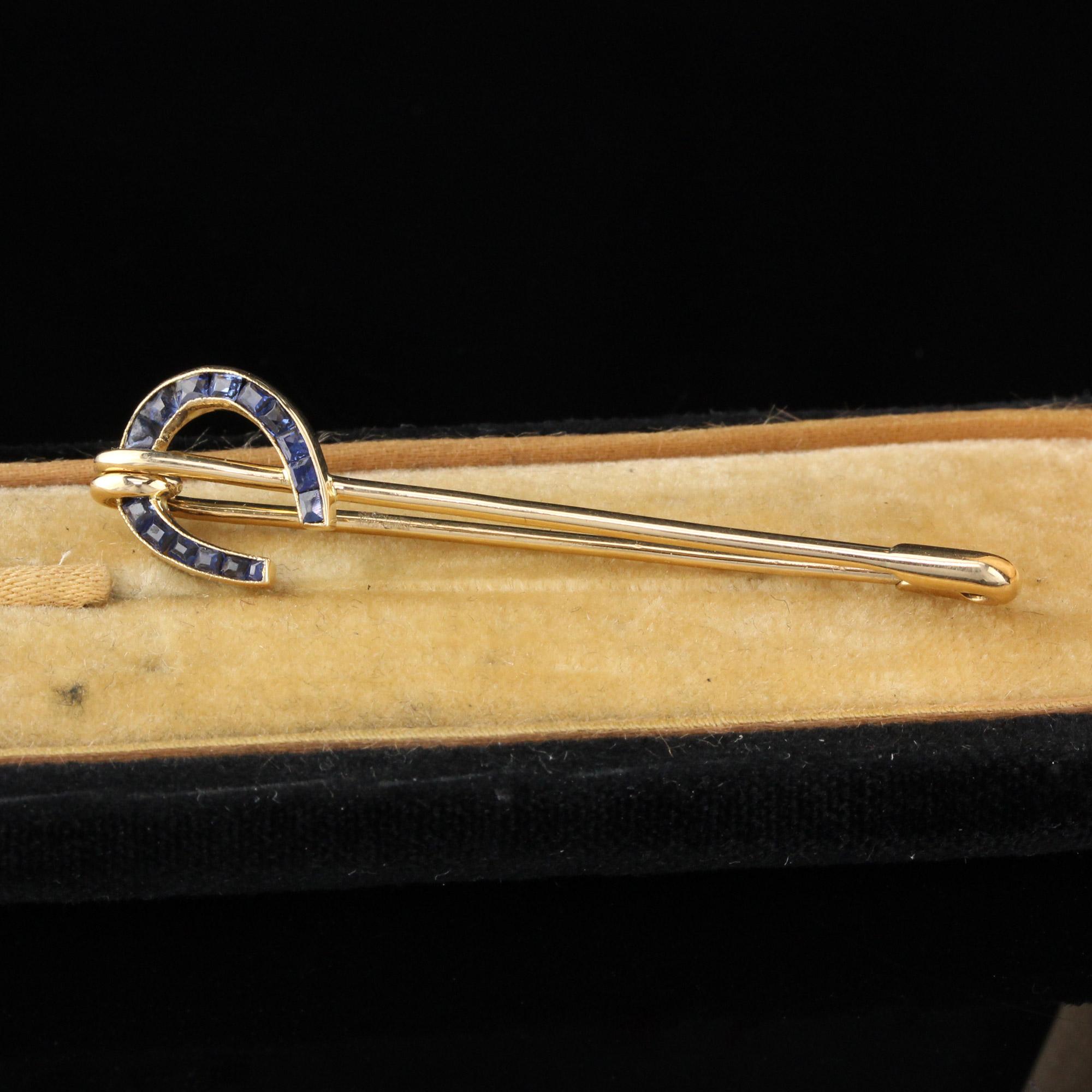 This is an amazing vintage safety-pin style sapphire horseshoe pin.

Metal: 18K Yellow Gold

Weight: 2.8 Grams

Gemstone Weight: Approximately 0.40 cts

Measurements: 11.4 mm in length