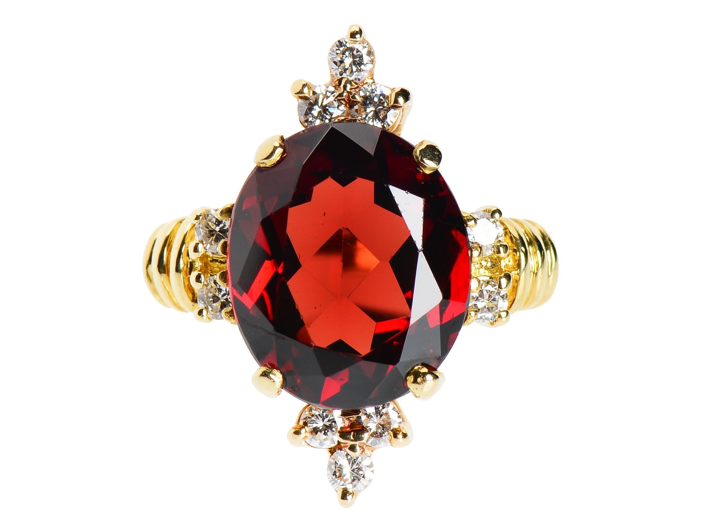 The port color of the Lucious garnet has fiery highlights and will call to you with its beauty. The garnet is 4.75 and though little of the 18kt gold shows on the front, the color is perfect, setting off the diamond and garnet brilliance. The garnet