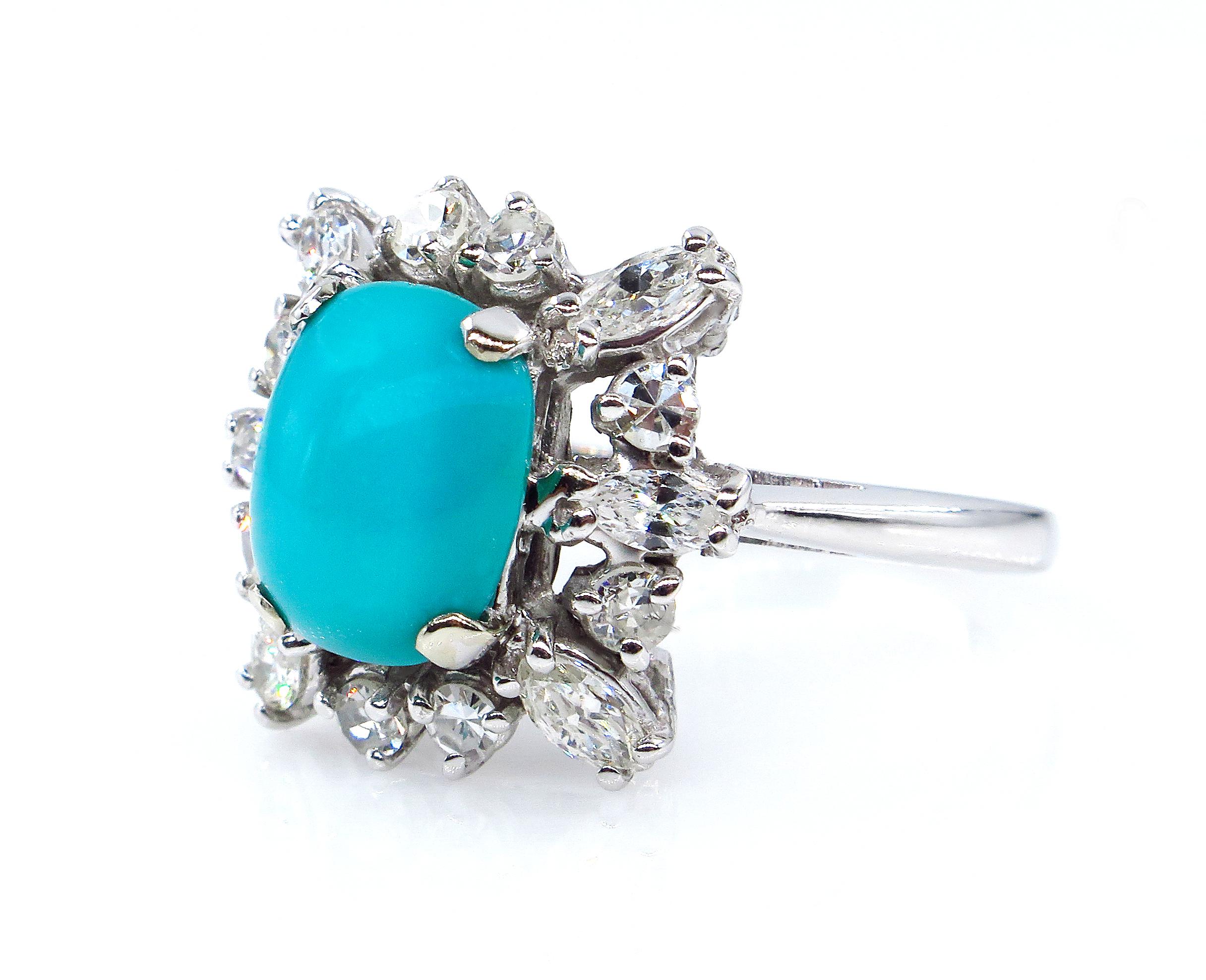 Make a sparkling statement with this Mid-20th Century Turquoise Diamond Platinum Cocktail Ring.
The multidimensional ring features a prong-set beautiful Blue Oval-Cushion shape Turquoise weighing shy 2.0ct (1.92ct) and measure 9.63x7.74x3.34mm. It