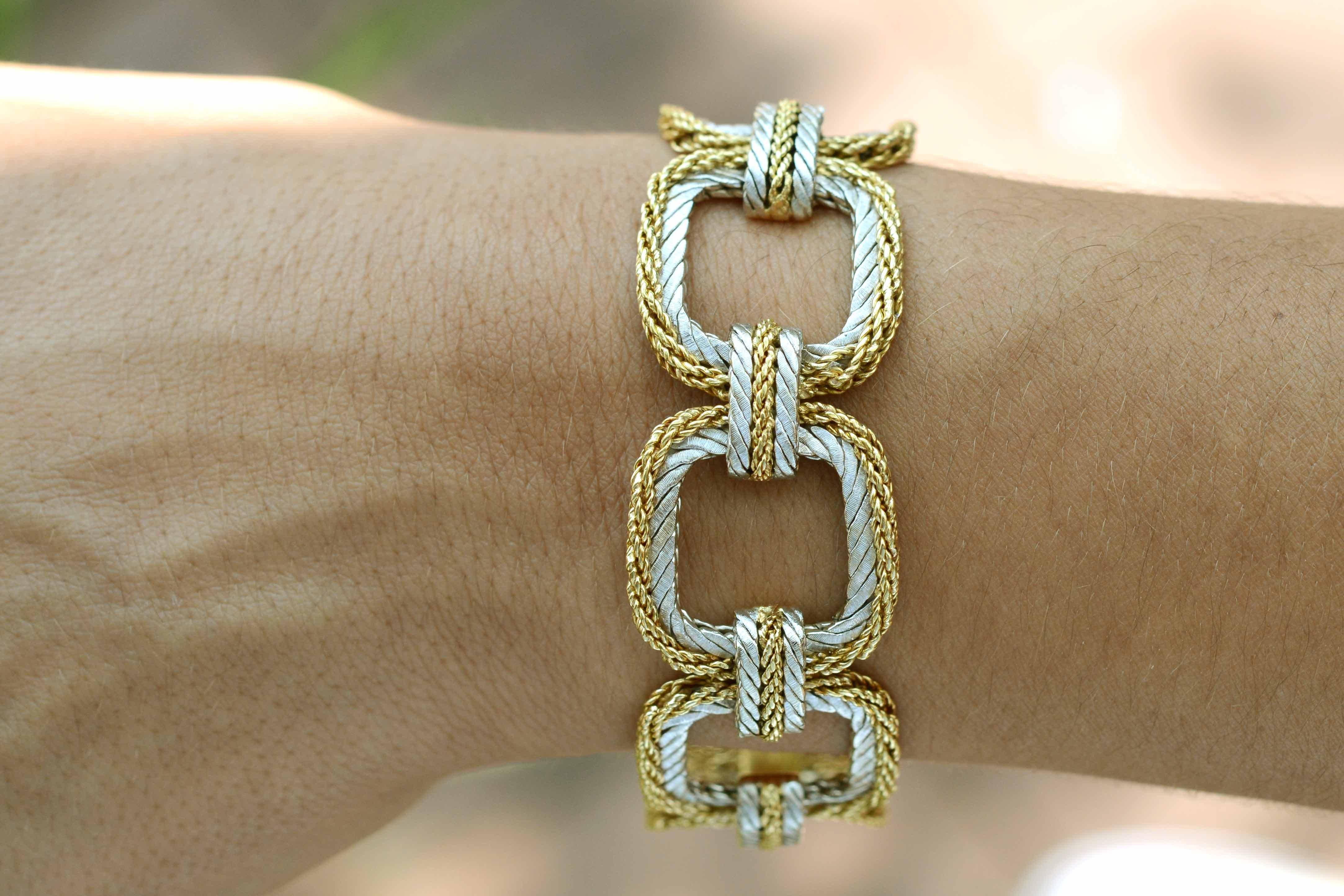 A bold, vintage Buccellati woven link bracelet crafted in 18kt yellow and white gold. This retired, intricate and textured design rendered in square links by the famous designer house in a hard to find 8