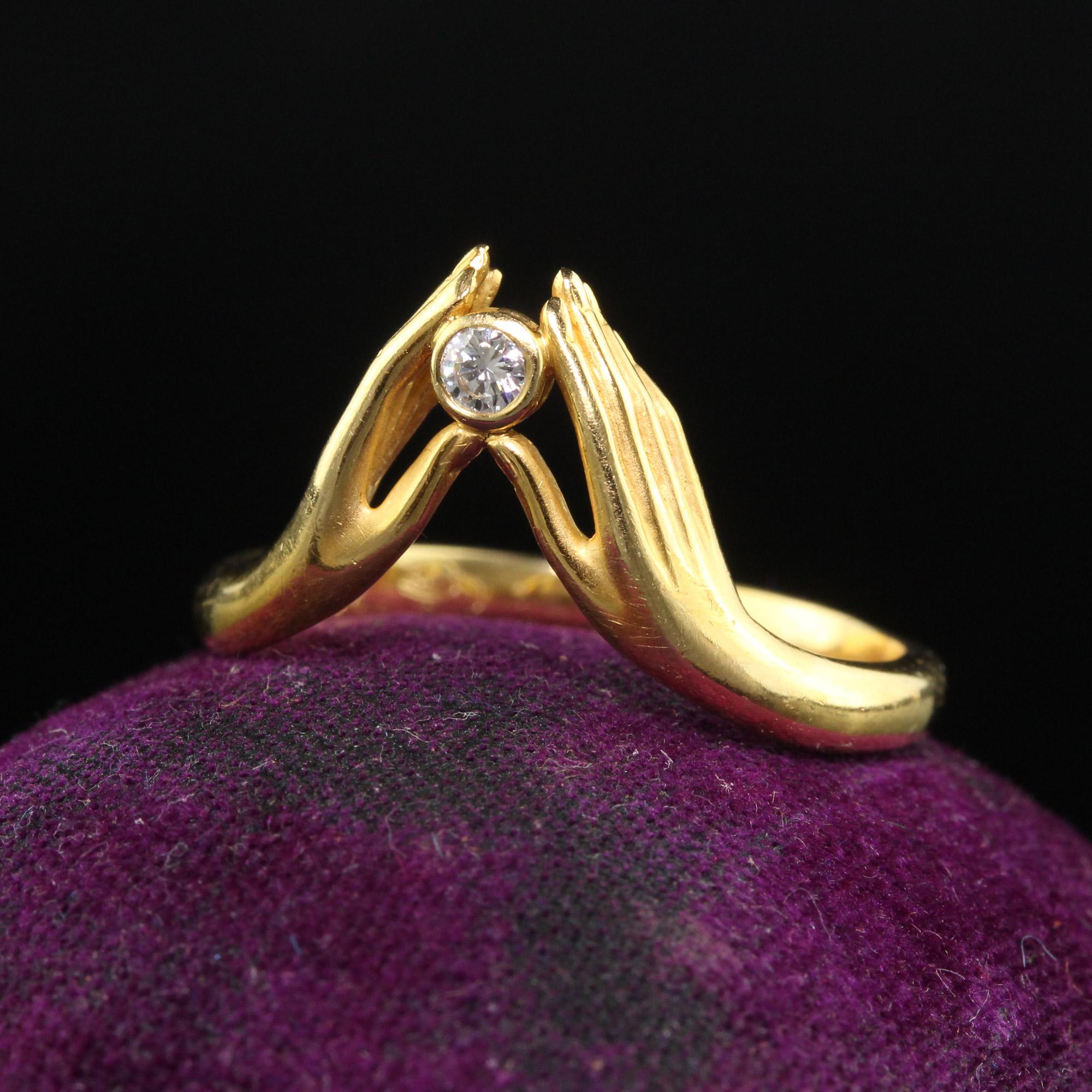 Beautiful Vintage Estate Carrera Y Carrera 18K Yellow Gold Diamond Hand Ring. This beautiful Carrera Y Carrera ring is crafted in 18k yellow gold. The center holds a white round diamond that is bezel set with two hands holding it up. The ring is in