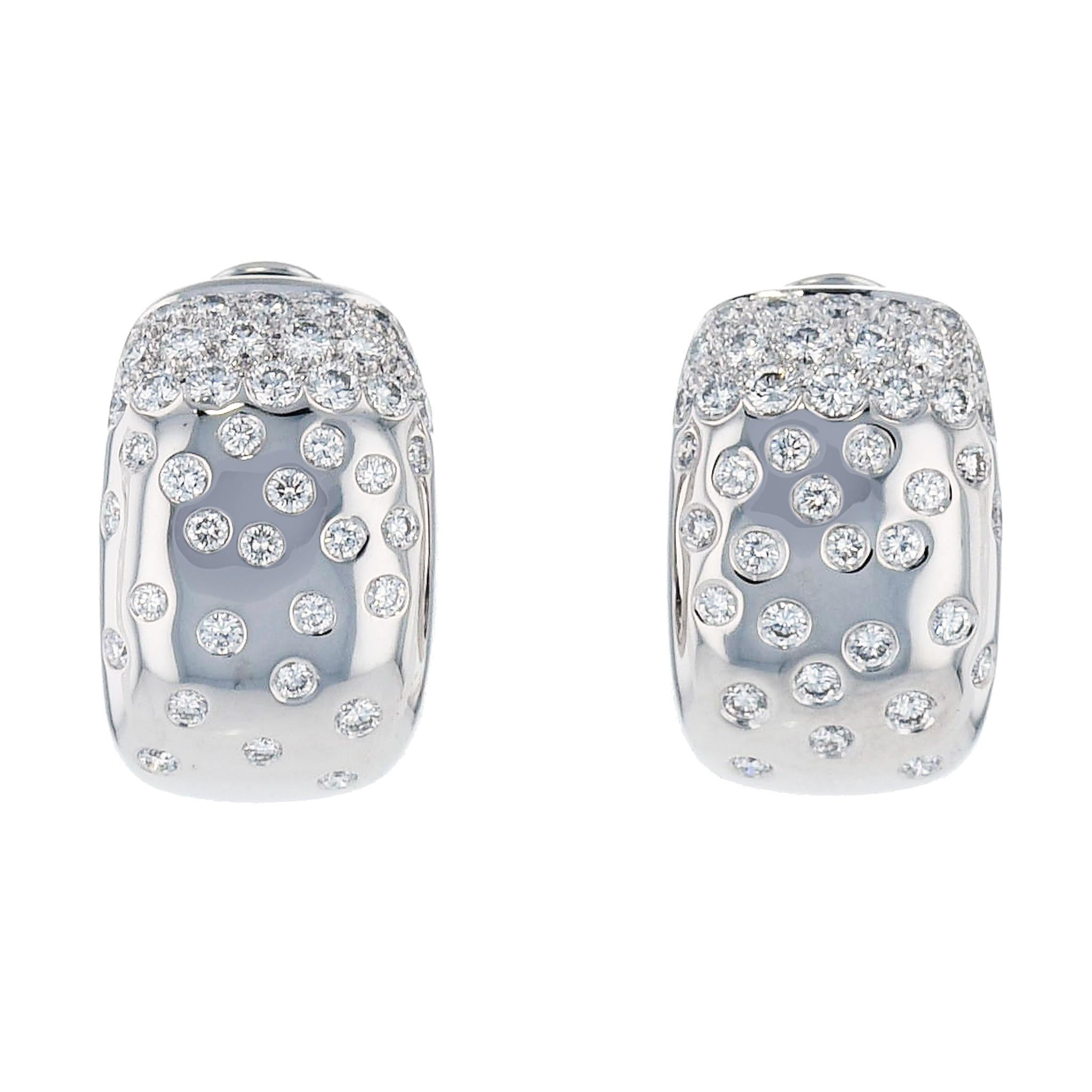 Crafted in 18 karat white gold, these classic Cartier Earrings (circa 1999) boast an engraved JS9471 and 1.20cts of Diamond TW in G-VVS color/clarity combination. 

Featuring the stylish 