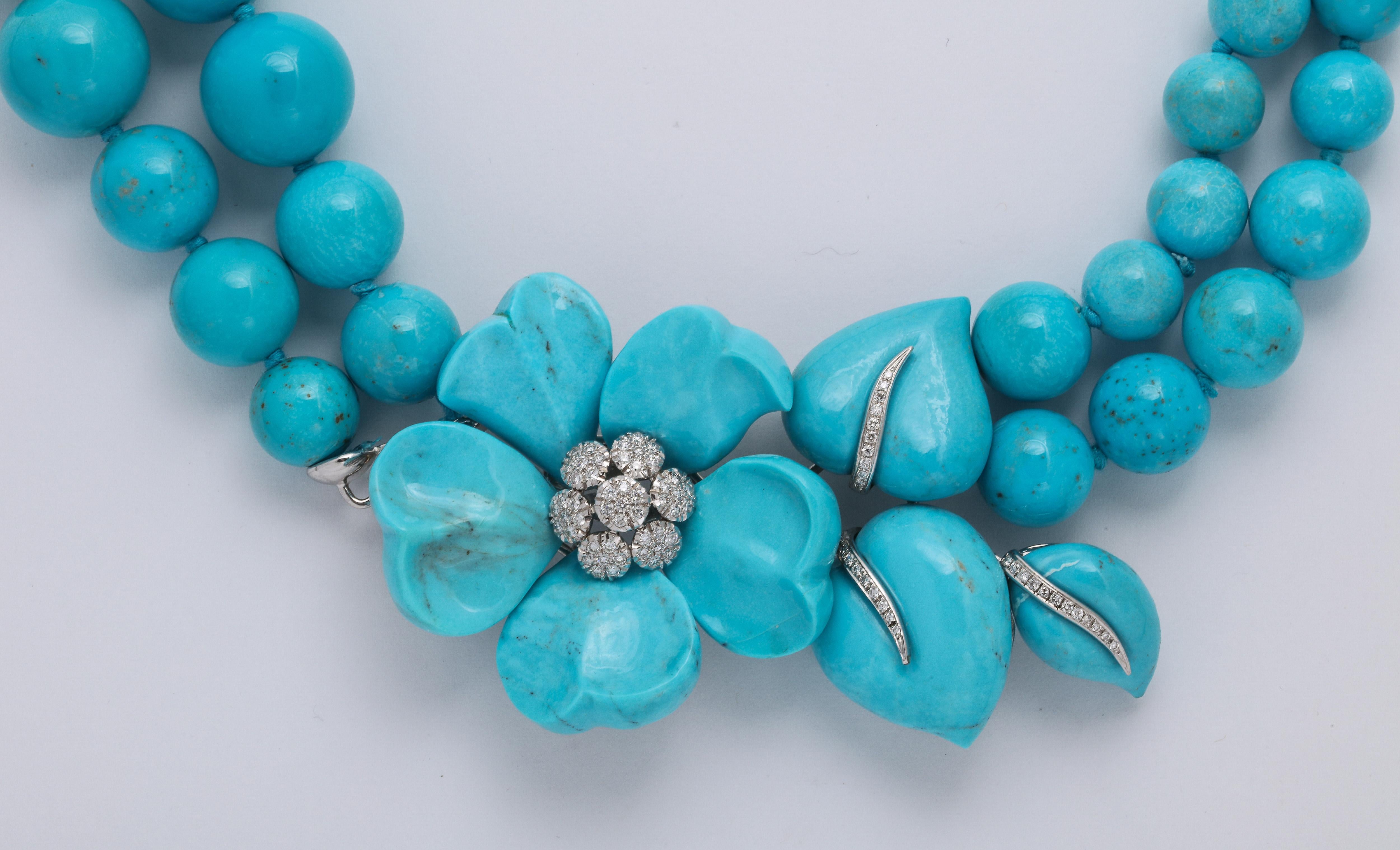 1970's Retro Gorgeous Turquoise Necklace, very unusual Estate piece!
Has an attached carved turquoise flower with diamonds 
Can be doubled or just hang low

320 Grams of Turquoise 
Necklace with White Gold Setting Stamped 750
79 Diamonds approx.
