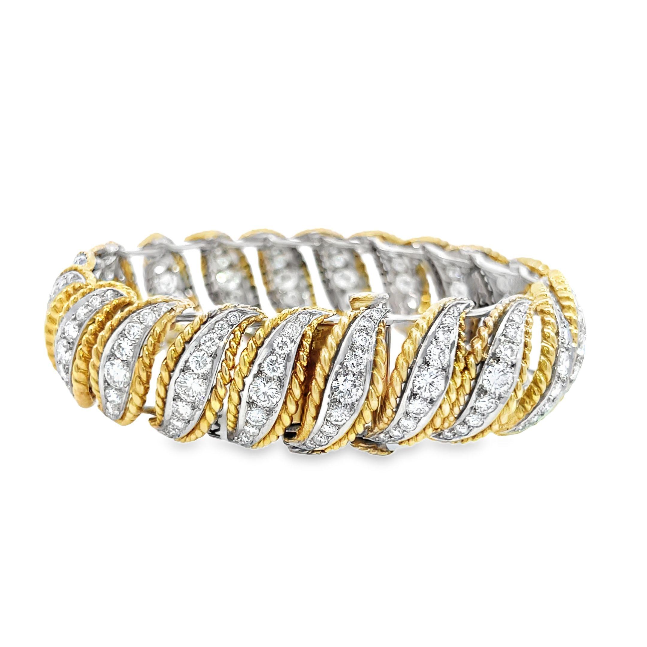 Ce bracelet vintage exquis est un véritable témoignage de l'élégance intemporelle et de l'artisanat méticuleux. Il allie le platine, l'or jaune 18 carats et 9,80 carats de diamants taillés en brillant pour former une pièce envoûtante. Conçue avec un