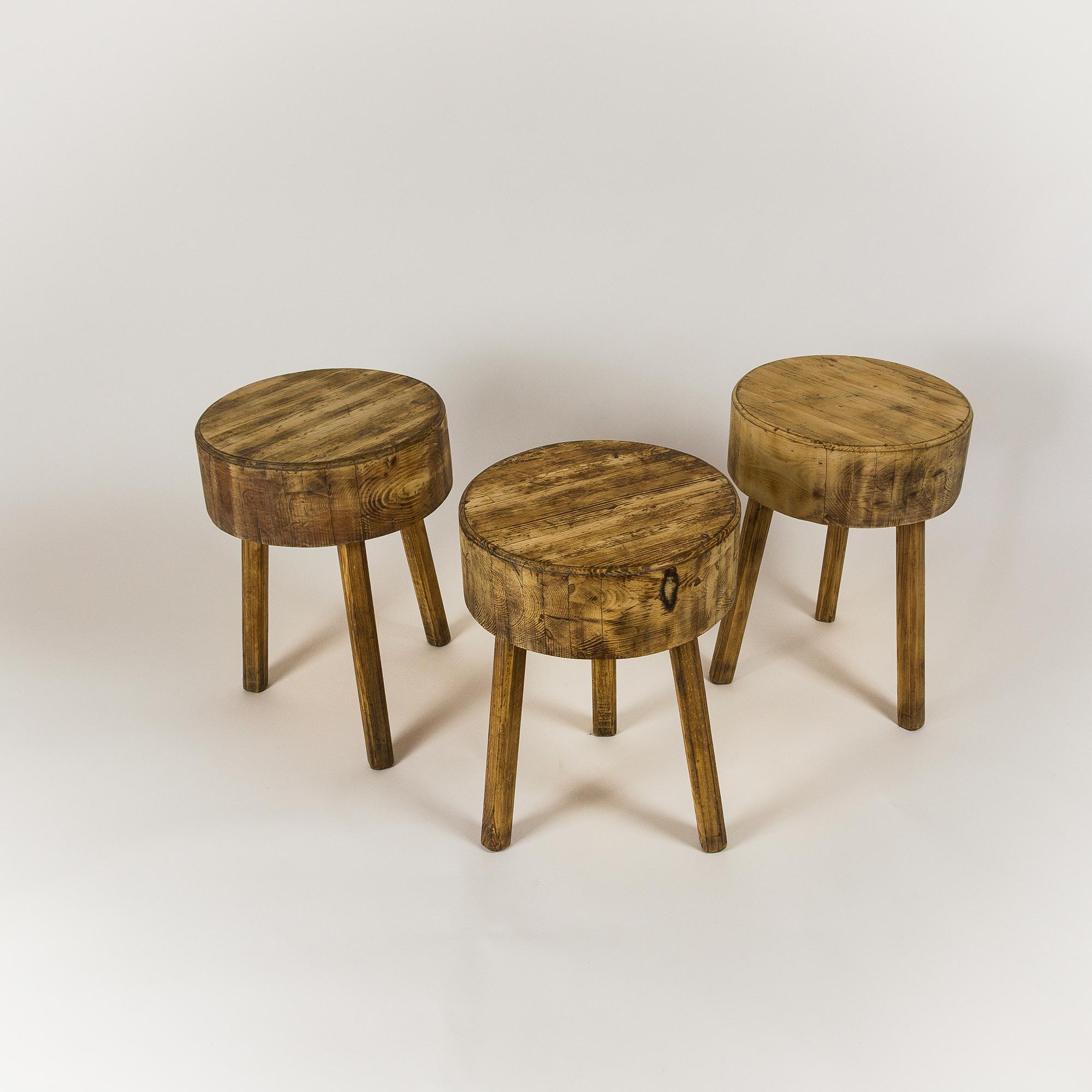 Solid three-legged estate-made stools. Perfect as seating or side table. France. Age unknown, probably circa 1950s.