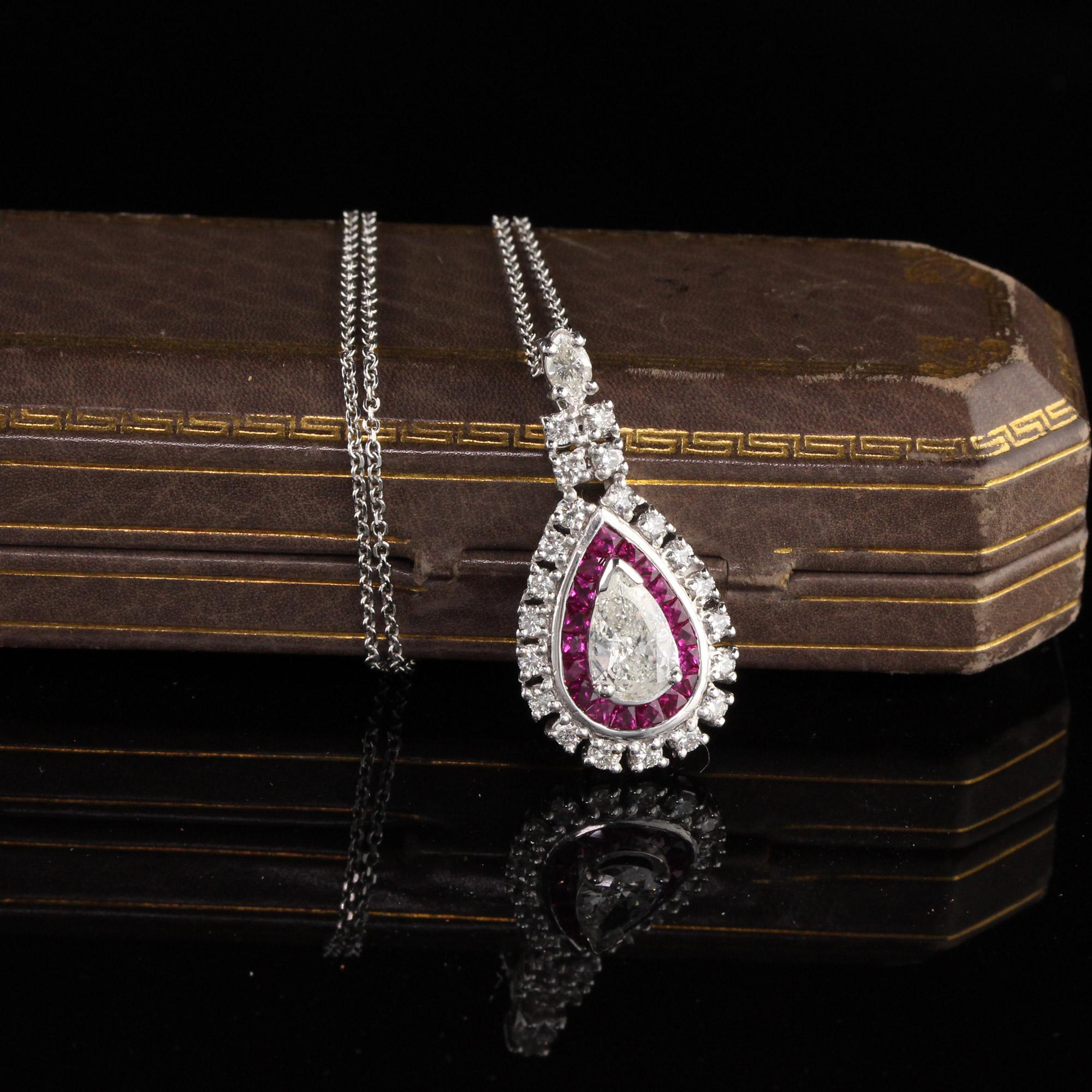Gorgeous Diamond and Ruby pendant with a 1.00 CT Pear Shape Diamond in the center

Metal: Platinum

Weight: 10.3 Grams

Total Diamond Weight: Approximately 2.00 CTS

Center Diamond Weight: 1.00 CTS

Center Diamond Color: H

Center Diamond Clarity: