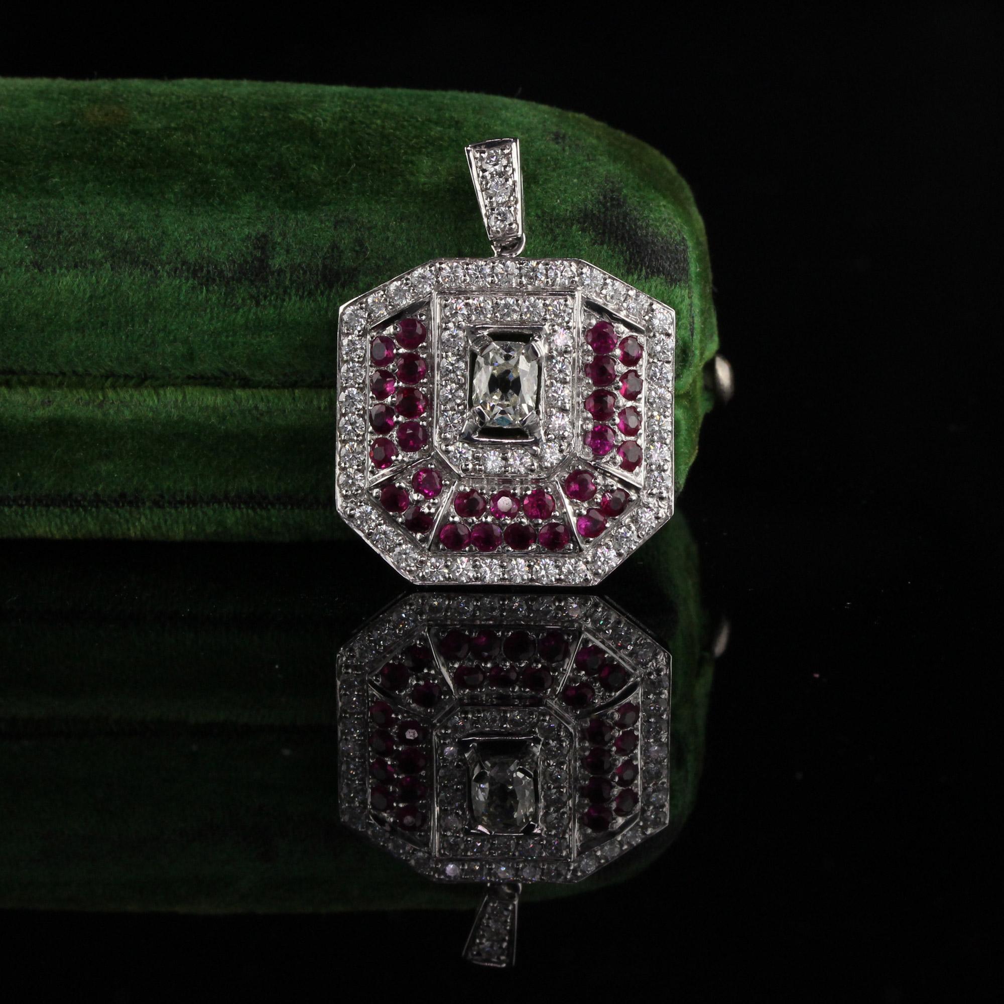 Stunning Diamond and Ruby Pendant with an Old Cushion Cut in the center of the pendant. 

Metal: Platinum

Weight: 8.4 Grams

Total Diamond Weight: Approximately 1.65 CTS

Center Diamond Weight: Approximately 0.50 CTS

Center Diamond Color: J -