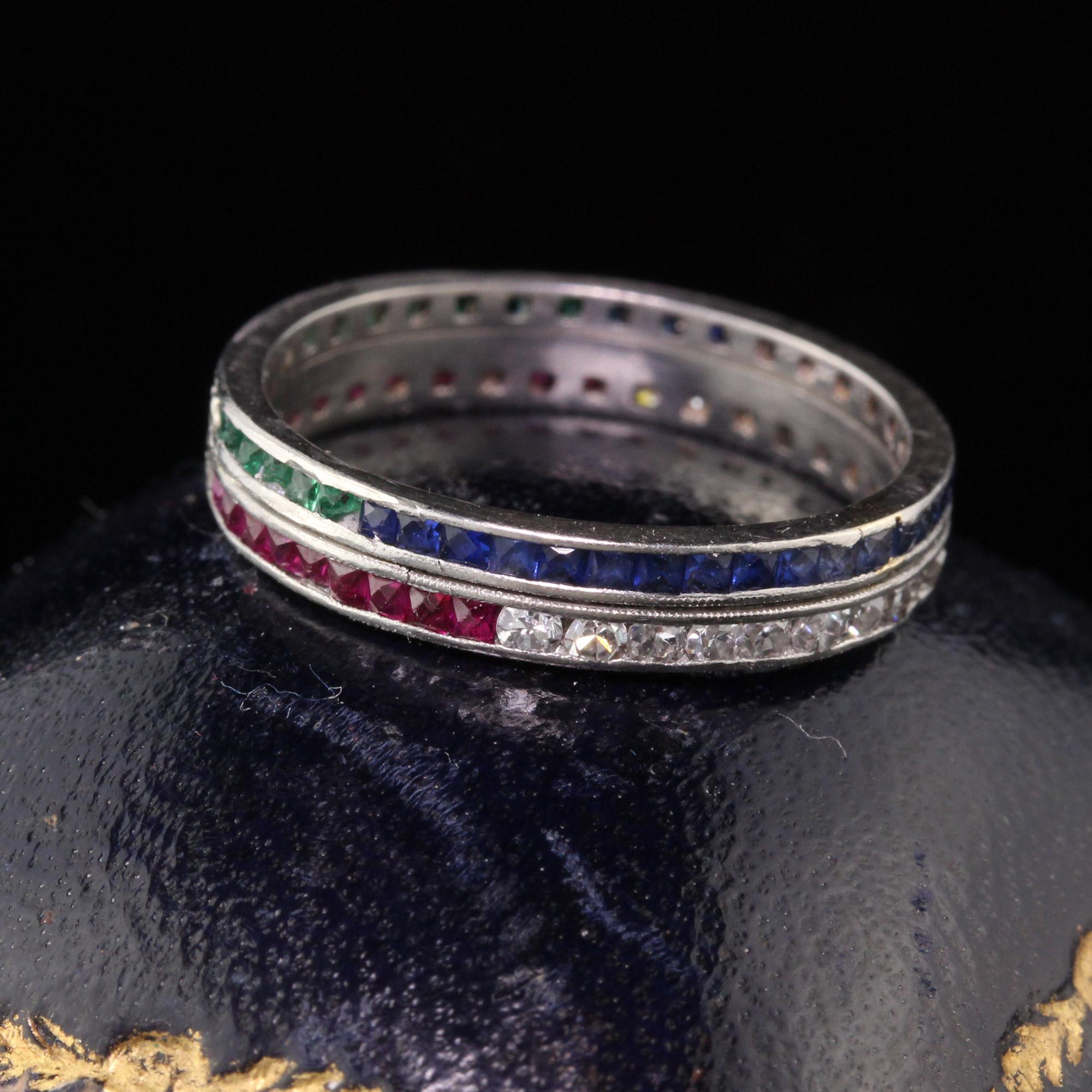 Incredible, unique, one of a kind vintage double row eternity band with one row of french cut sapphires & emeralds and another row of single cut diamonds and french cut rubies. We've never seen another like it! can be worn at different positions to