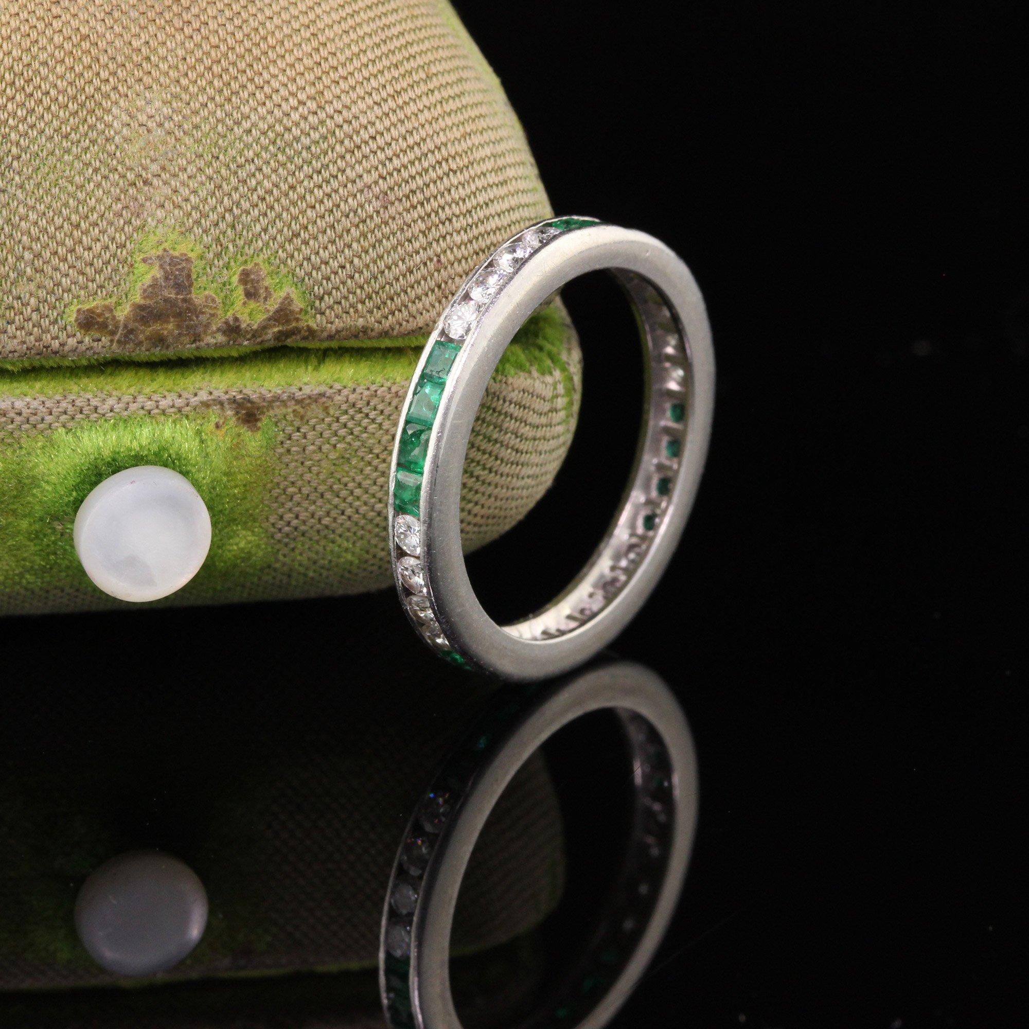 Beautiful Vintage eternity band in platinum with alternating square-cut emeralds and round diamonds in sets of 4. The perfect wedding band or stacking band! Emeralds are a very soft stone and some emeralds have small chips that are only visible with