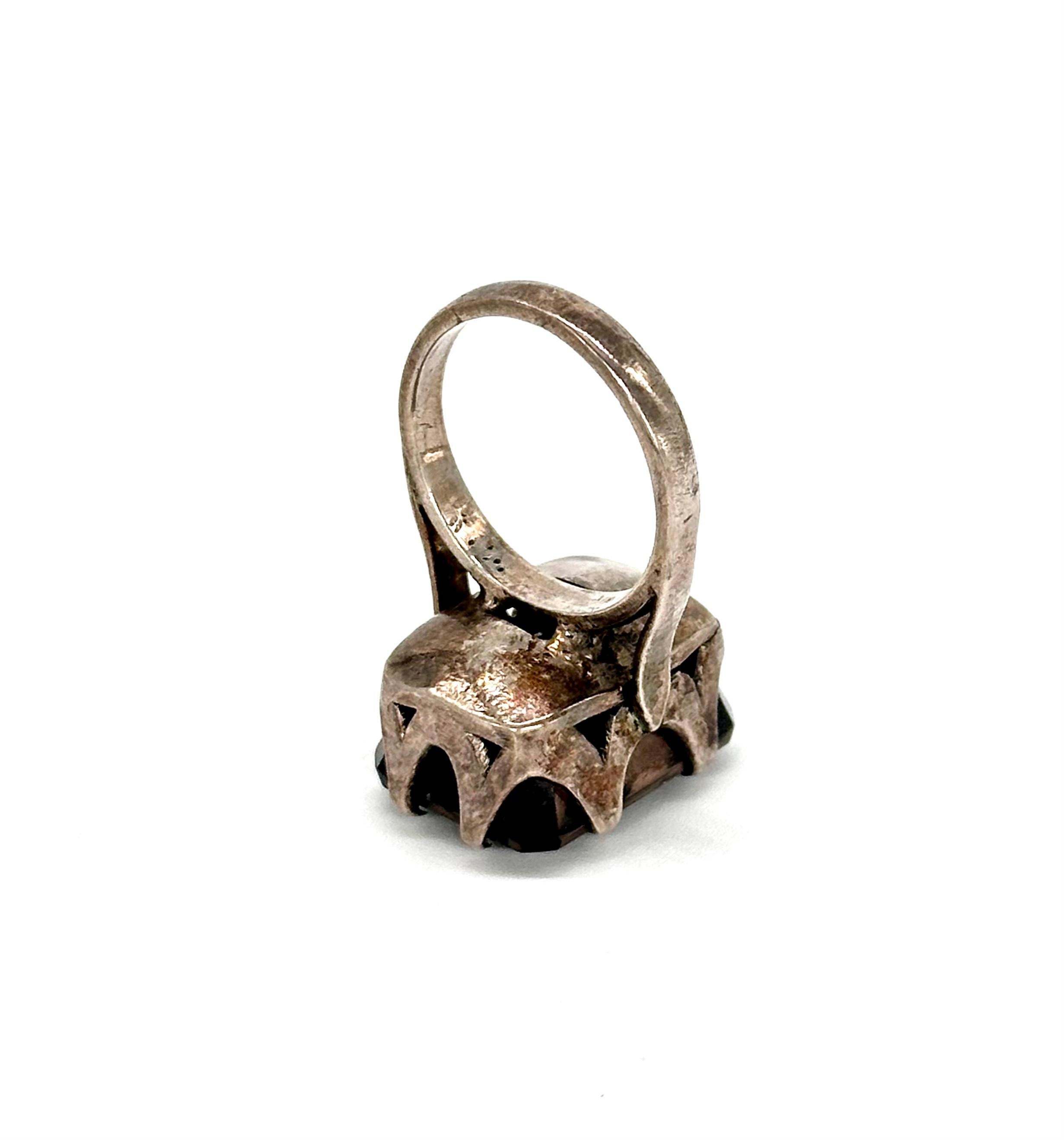 The ring consists of;
Gross weight- 8.700grams
Metal- Silver
Metal purity- 925 silver
Metal color- Oxidized silver
Gemstone- Smoky quartz 
Gemstone- origin
Ring face size- 19.5 mm x 14.8mm

Ring size- US 6