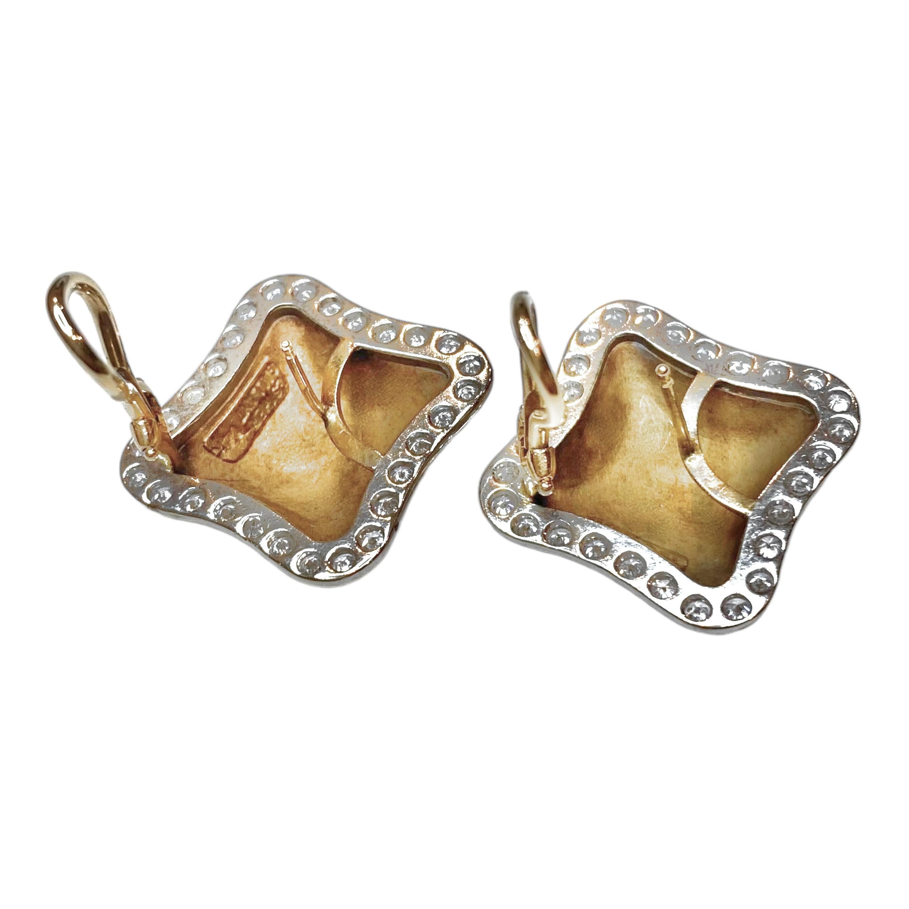 Vintage Esther Gallant 14K yellow and white gold earrings with post and omega backings. Bright polished finish on front, satin finished under gallery.
56 round brilliant cut diamonds: 1.75ctw. Color: F-G, Clarity: VS1-VS2
Measurements: 26 mm H x 26