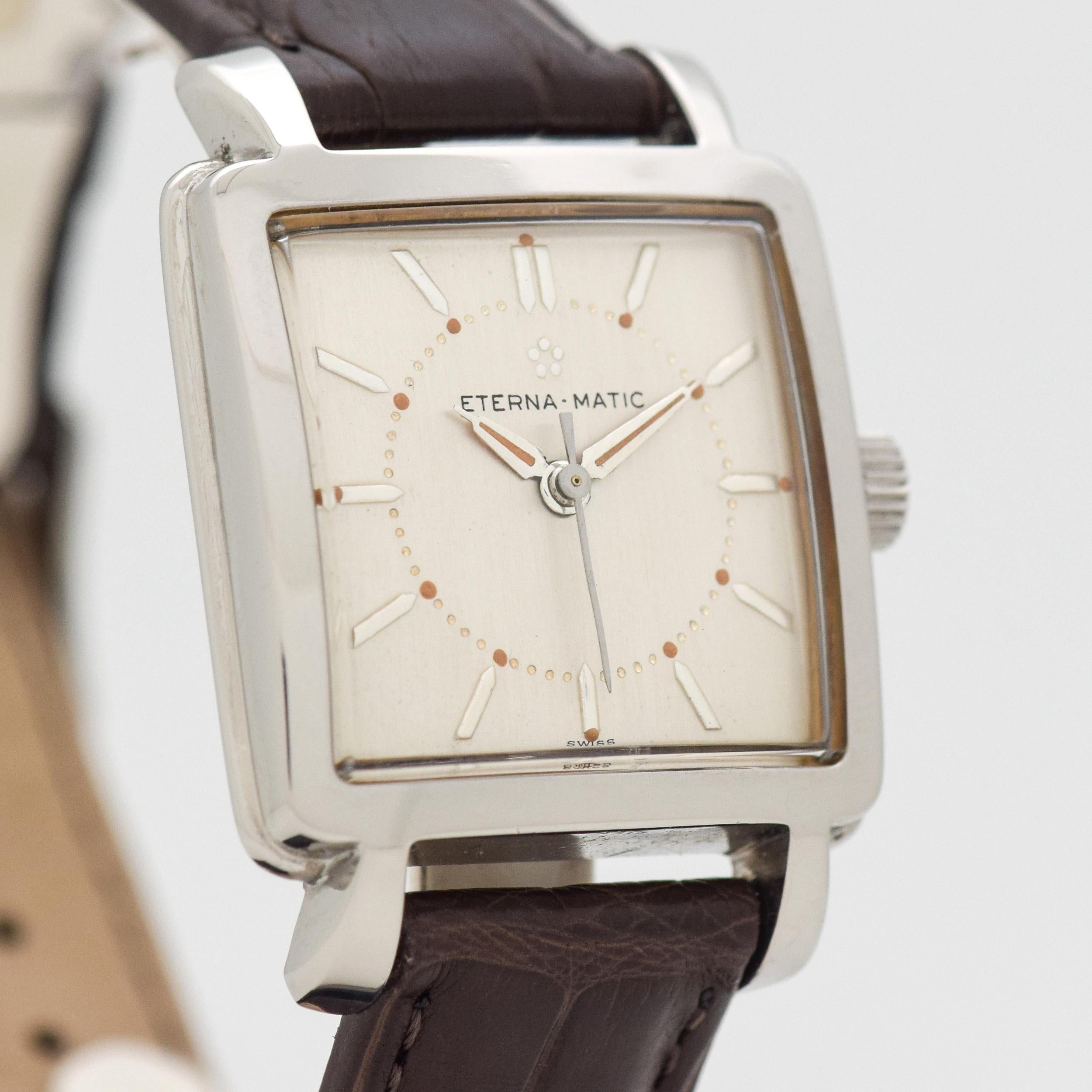 1952 Vintage Eterna Eterna-Matic Stainless Steel Square Automatic watch with Silver Dial with Steel Pointed Arrow Tip Stick/Bar/Baton Markers. 27mm x 38mm lug to lug (1.06 in. x 1.5 in.) - 17 jewel, automatic caliber movement. Triple Signed.