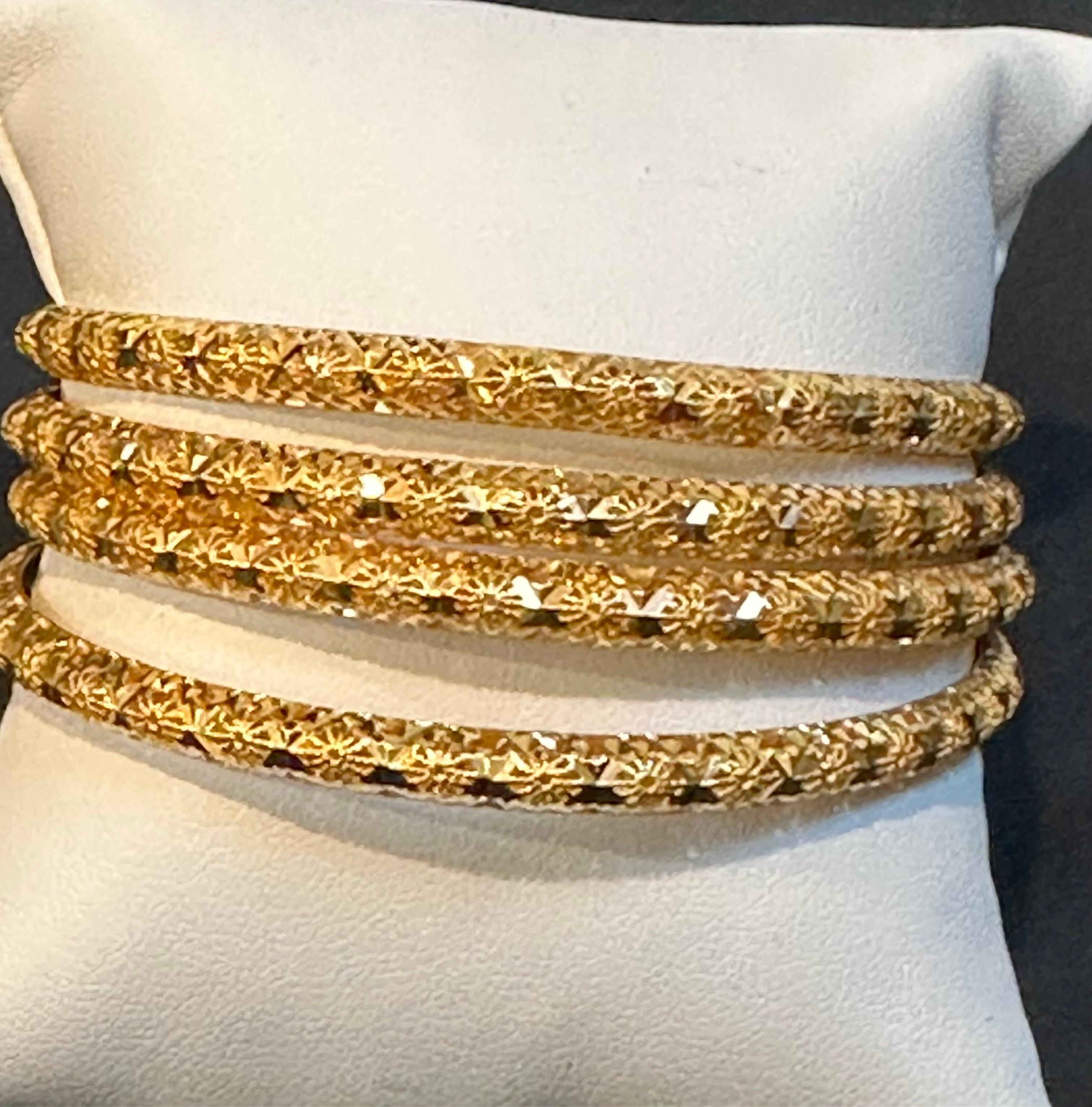 
A quality set of 4 twenty two karat (21K) yellow gold bangle bracelets ,finely crafted in UAE Dubai.
Slide on style measuring 2-3/4 inches in diameter and 5 mm wide .
It will fit to a medium  wrist or softer hands to go thru

 This versatile Pair