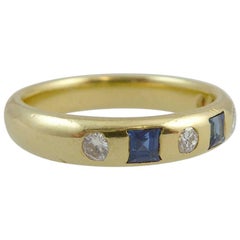 Vintage Eternity Ring Set with Sapphires and Diamonds in a Yellow Gold Band