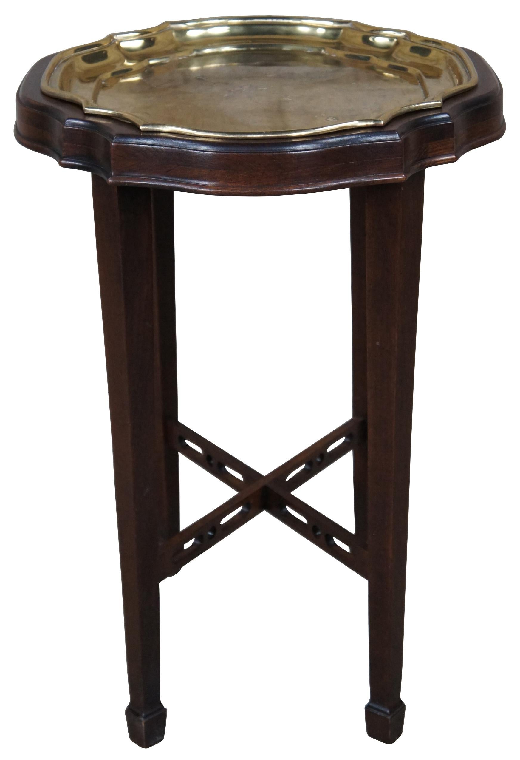 Vintage Ethan Allen Georgian Court plant stand or tray table. Made of cherry feauturing serpentine form with a brass tray table insert and reticulated stretcher. 11 3031. Measures: 22