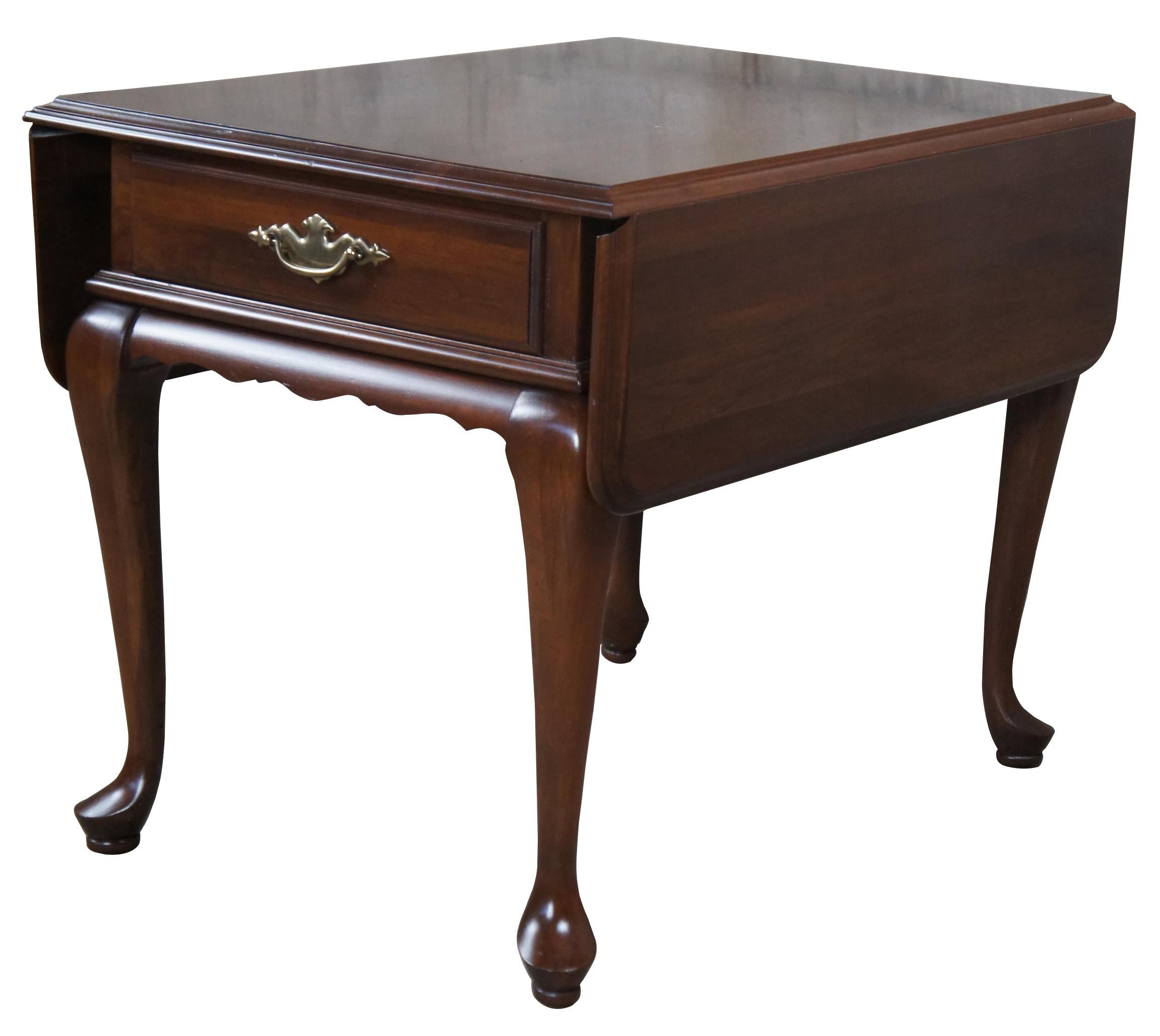 Vintage 1980s Ethan Allen Georgian Court collection drop leaf Pembroke table. Made from Cherry featuring Queen Ann styling with pad feet, federal hardware and one drawer. 11-8164, 18 1082.

27