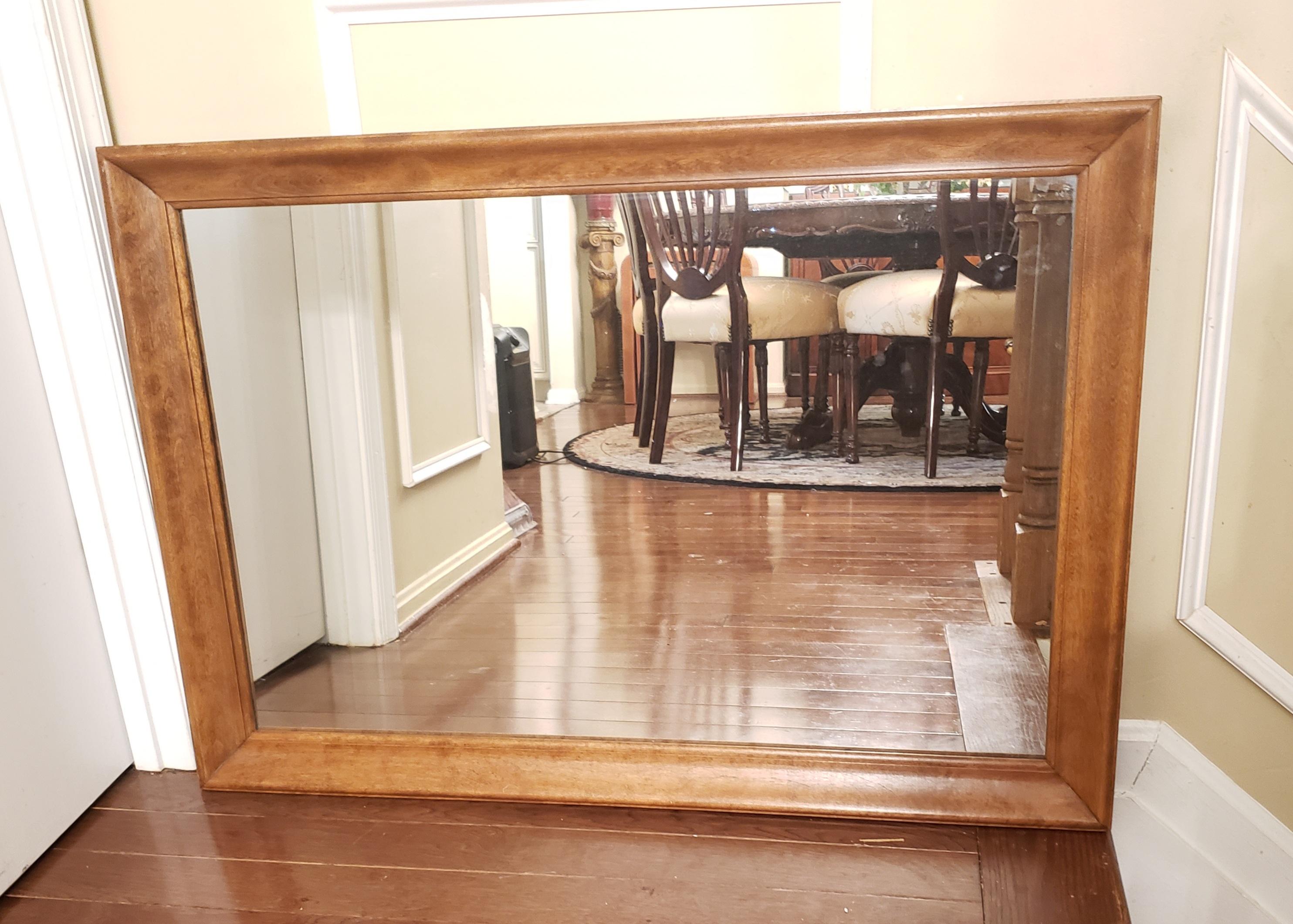 Vintage Ethan Allen Heirloom nutmeg maple colonial style wall mirror. Very good vintage condition. Measure 40.5
