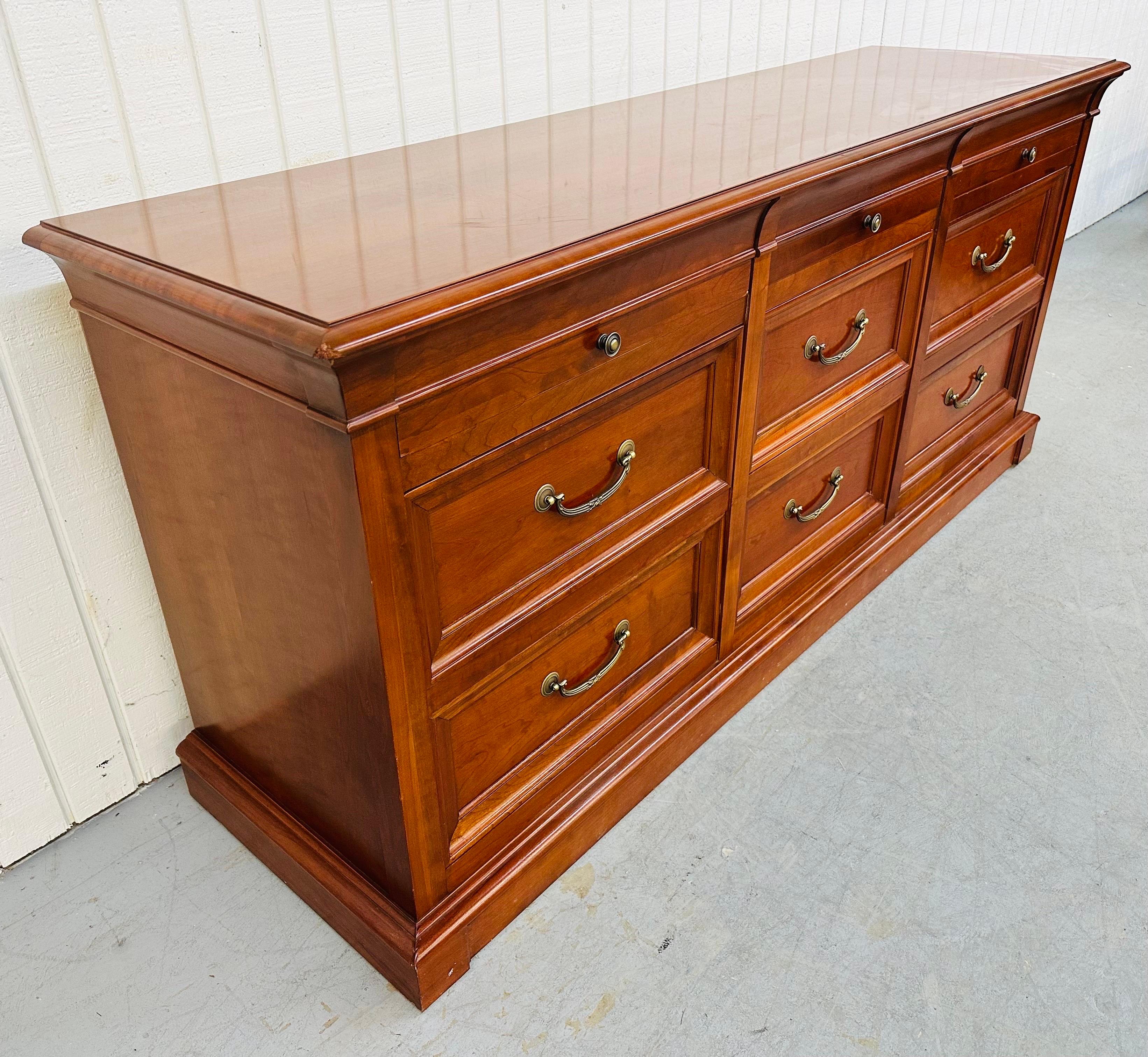 This listing is for a vintage Ethan Allen Regency style Medallion Collection Cherry 9-Drawer Dresser. Featuring nine drawers for storage, original hardware, straight line Regency style design, and a beautiful cherry finish. This is an exceptional
