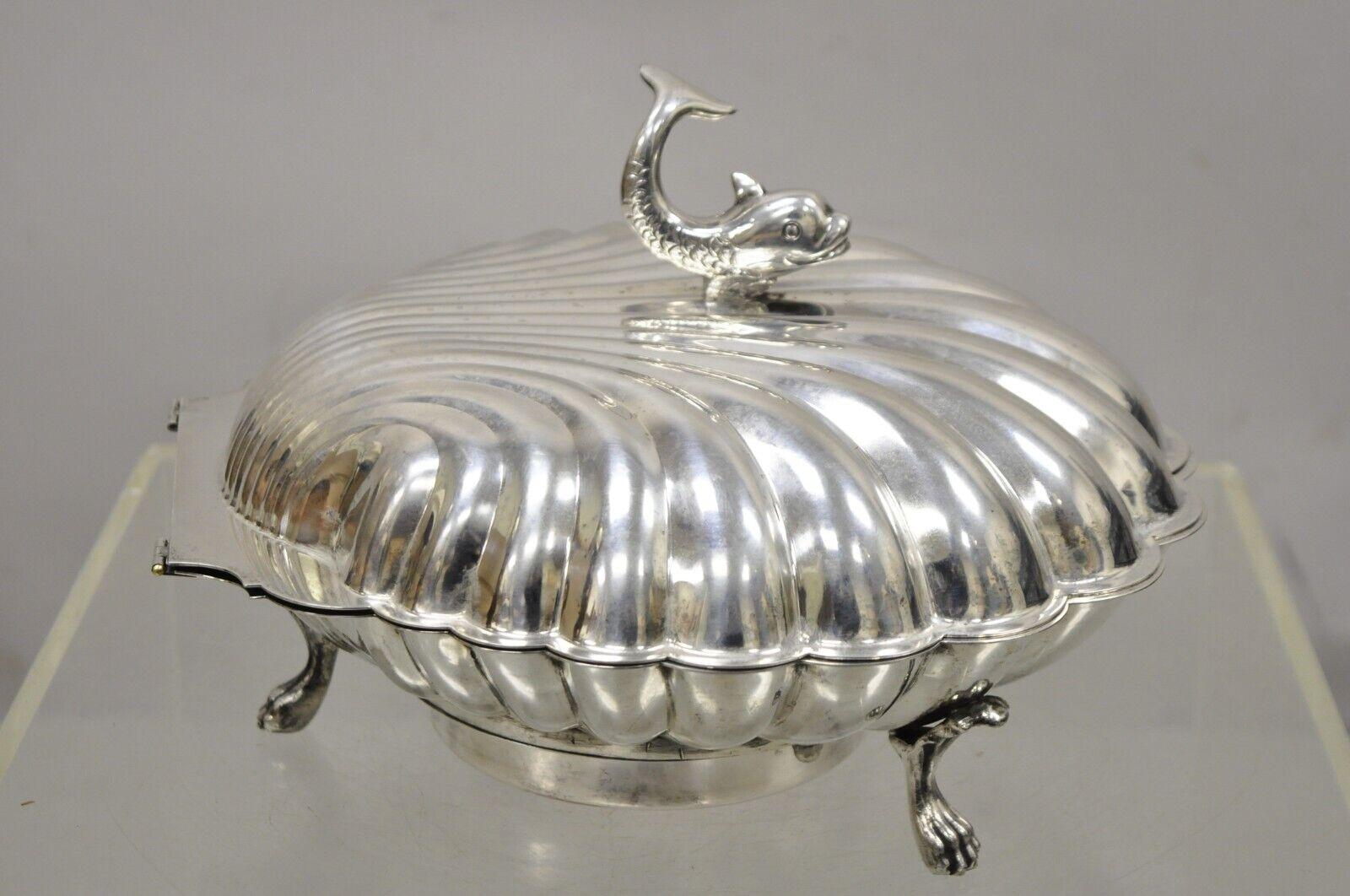 Vintage Eton Dolphin Handle Clam shell silver plate Electrified Bun Warmer. Item featured is raised on 3 paw feet, smiling dolphin finial handle, hinged clam shell lid, electric plug for warmer, original stamp, great style and form. Circa Mid 20th