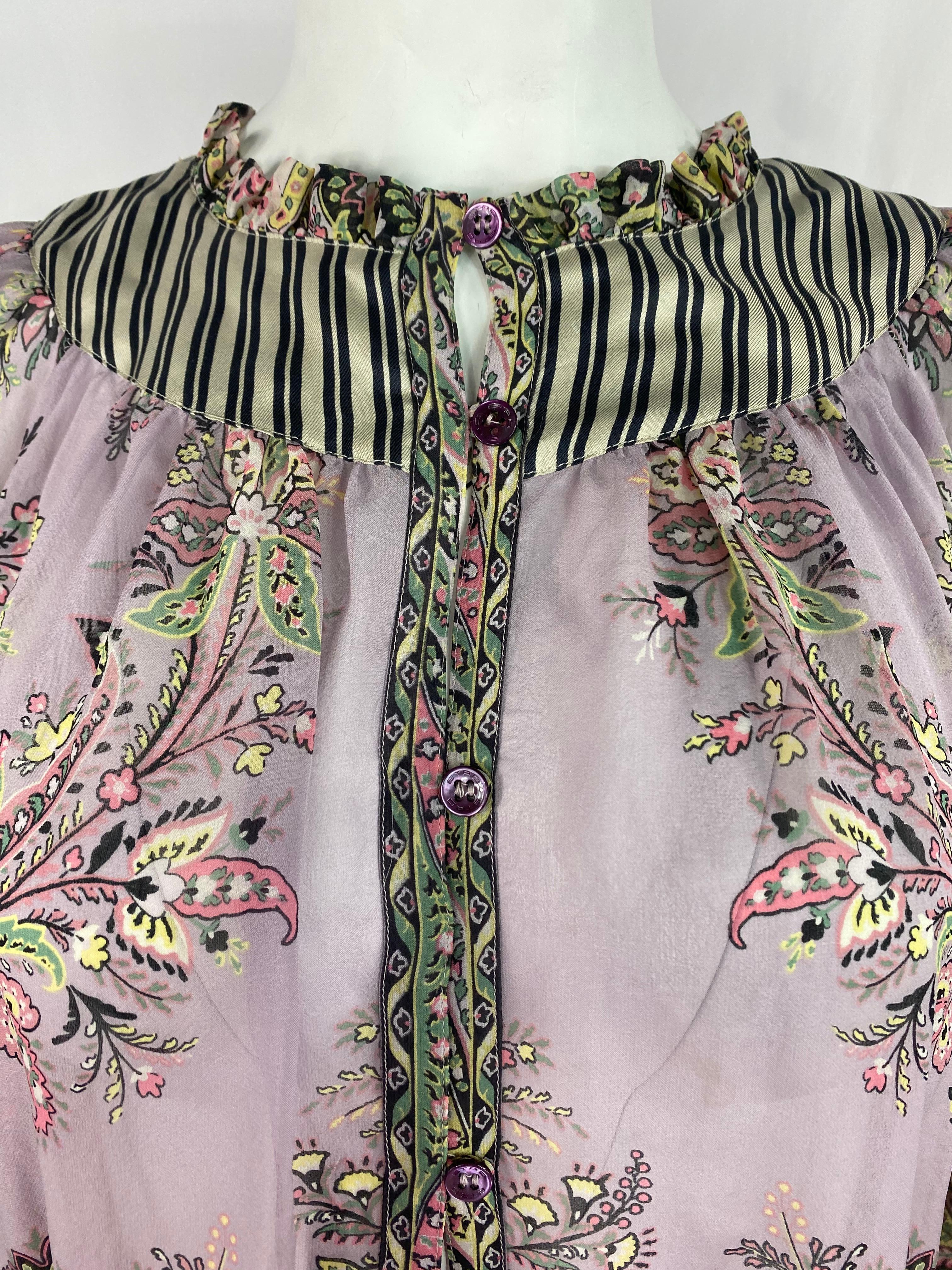 Product details:

The blouse is designed by Etro, featuring violet/ purple  floral and navy and white striped pattern design with long sleeves and front button closure. Made in Italy.