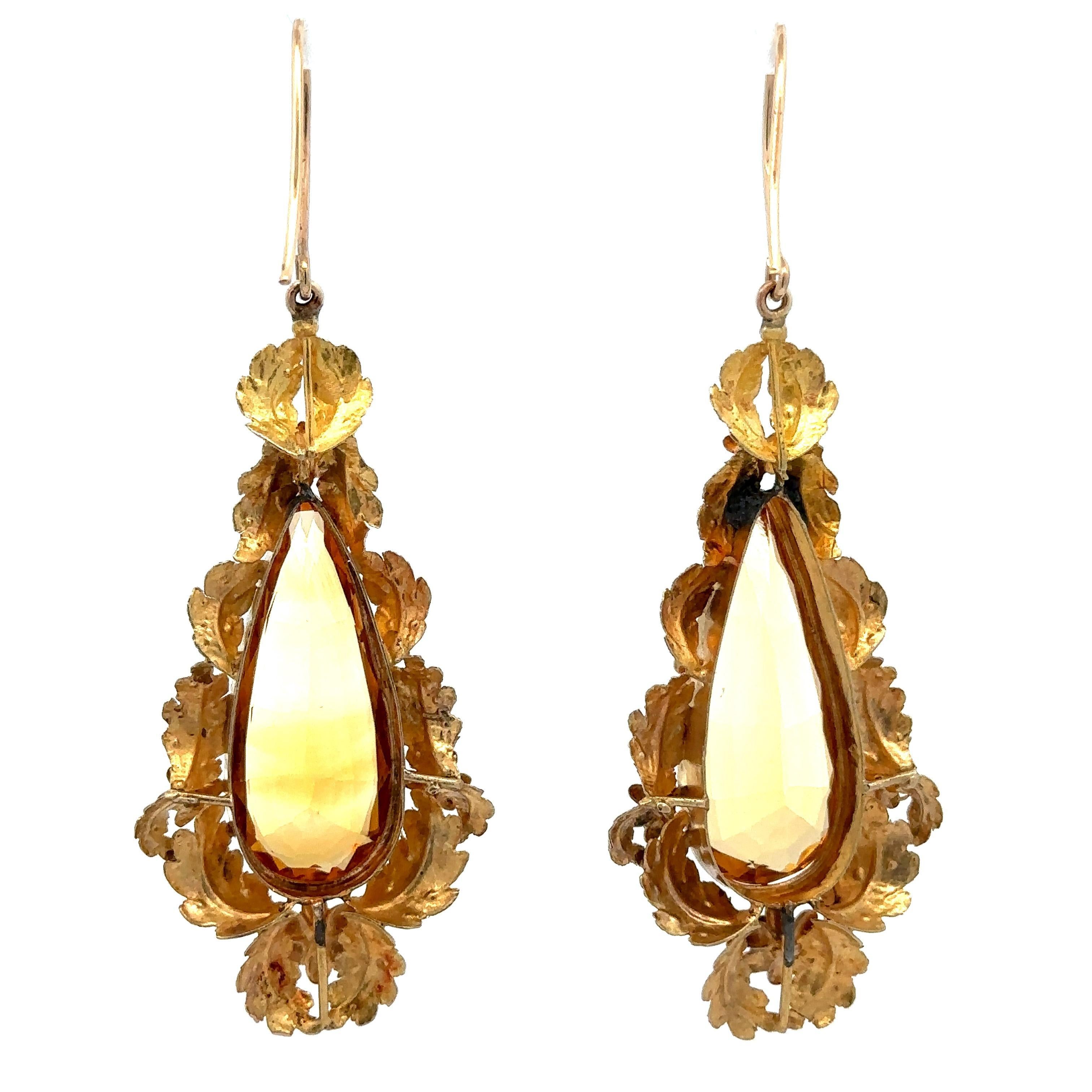 --Stone(s):--
(2) Natural Genuine Citrines Collet - Elongated Teardrop Cut - Prong Set - Yellowish-Orange Color - 30.8x12.7mm each (approx.)

Material: Solid 14k Yellow Gold w/ Gold Wash (some solder spots on backs not gold)
Weight: 17.59