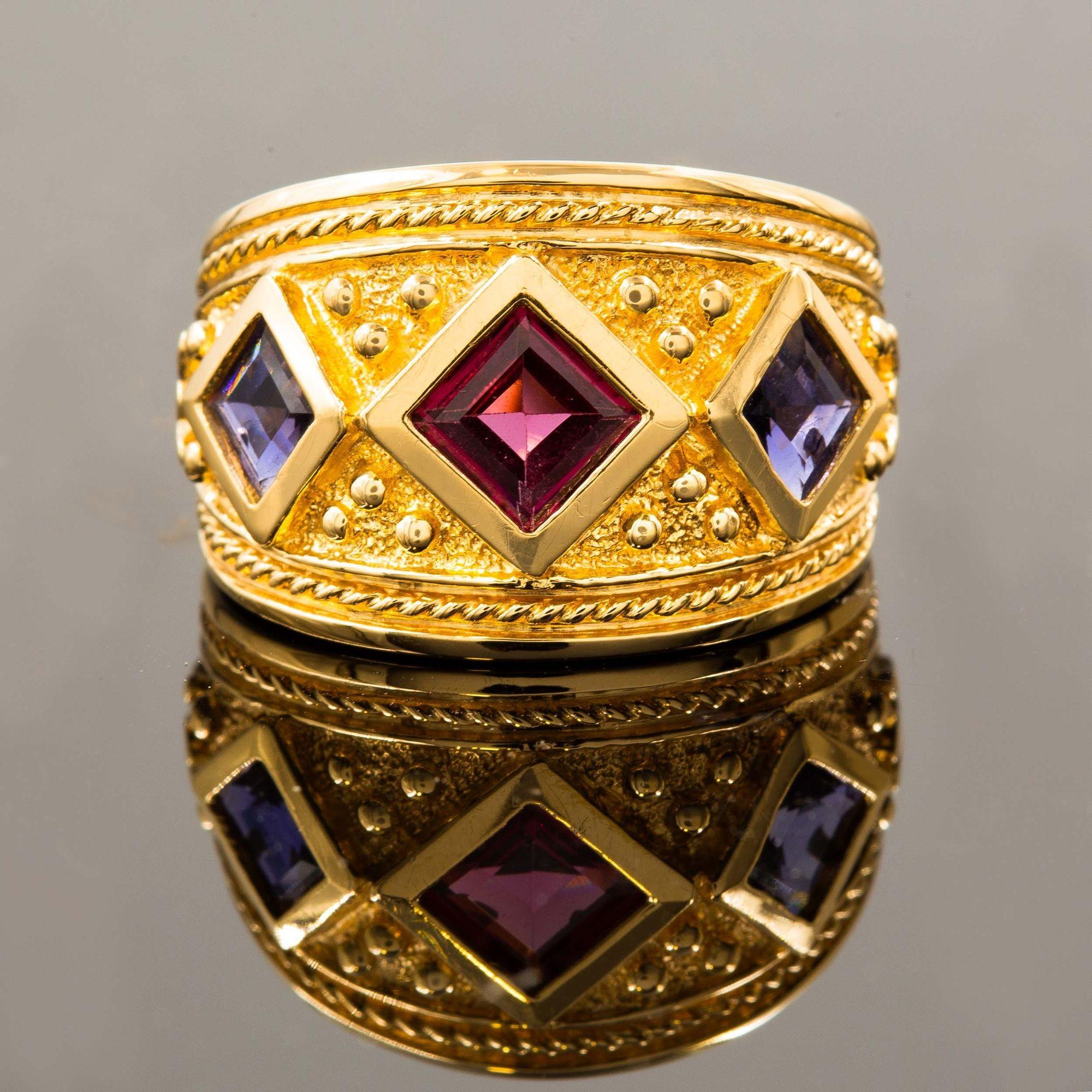 ETRUSCAN REVIVAL STYLE 14K YELLOW GOLD AND GEMSTONE RING  SIZE 8
Item # 308GEX11P 

A positively stunning vintage ring by Art's Elegance, it features a stippled-ground with raised high-polish square bezel-set gemstones set within a twisted-rope