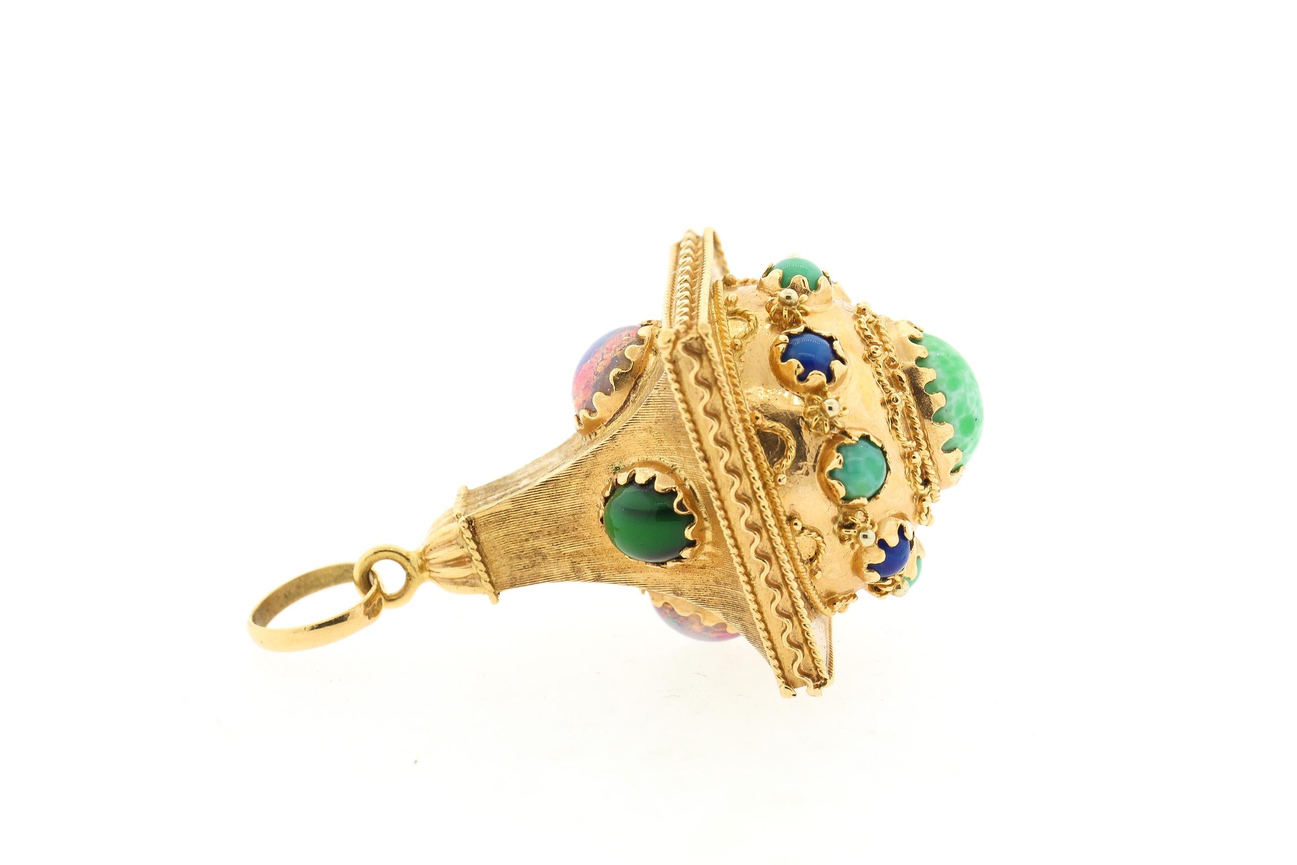 A large Etruscan Revival 18k gold pendant set with cabochon opal, lapis, malachite and turquoise, circa 1960. The pendant is in the shape of a lantern with twisted wire work detail. It comes with a large bail ready to hang from that perfect chain,