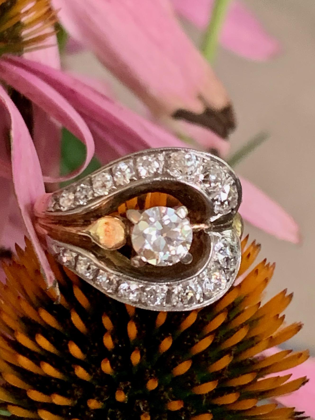 This vintage Diamond fashion ring features one Euro cut Diamond at .60ct as the center stone.  There are additional 16 euro cut side Diamonds surrounding the center stone. They are approximately 1.20ctw. 
Average grades: VS-SI(2) G-H
Weight: 7.2