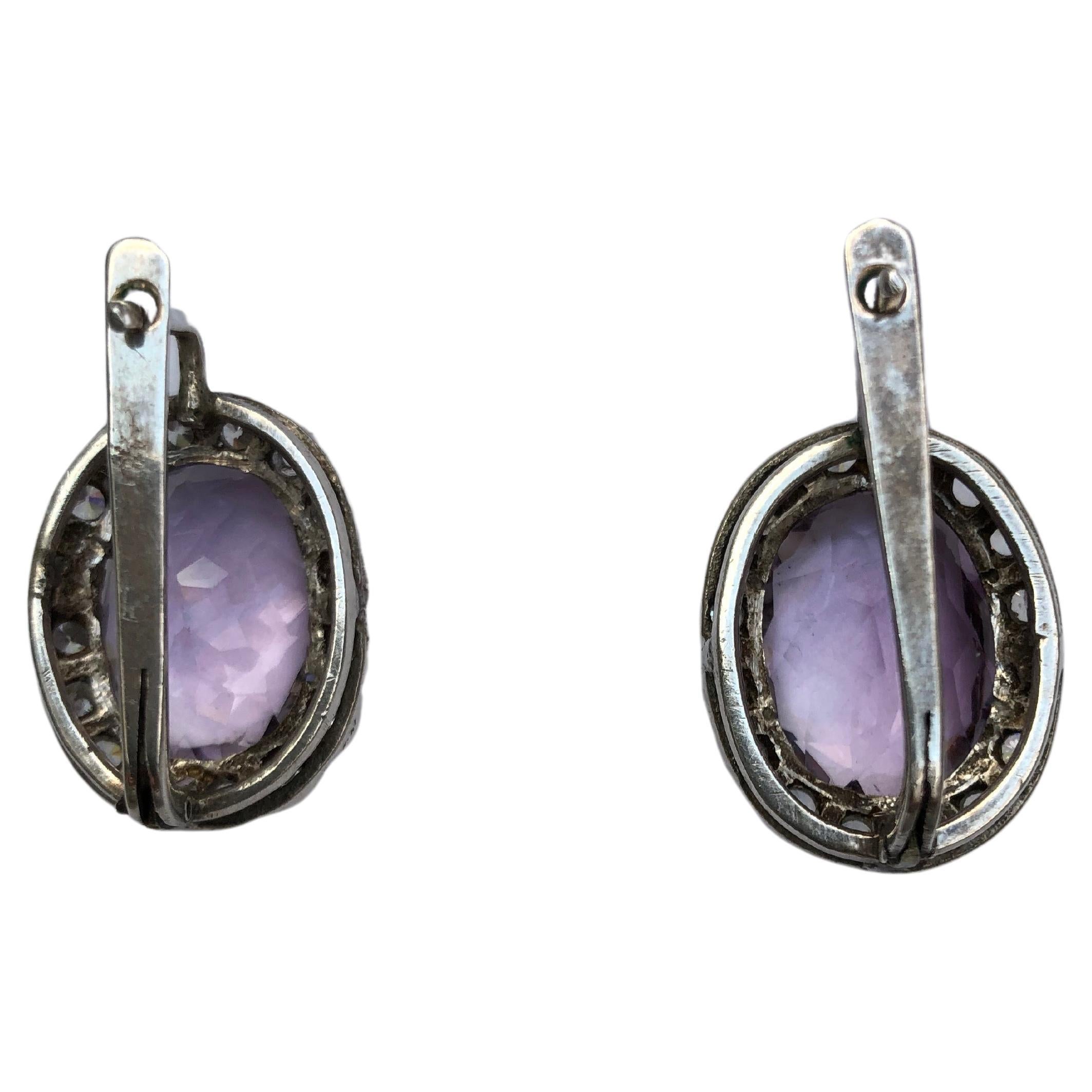  Pair of vintage European stunning amethyst drop earrings. Beautiful large oval amethyst surrounded with  sparkling cubic zirconia,  mounted in sterling silver marked 925, about 0.98 inch by 0.78 inch, weight about 13 grams.