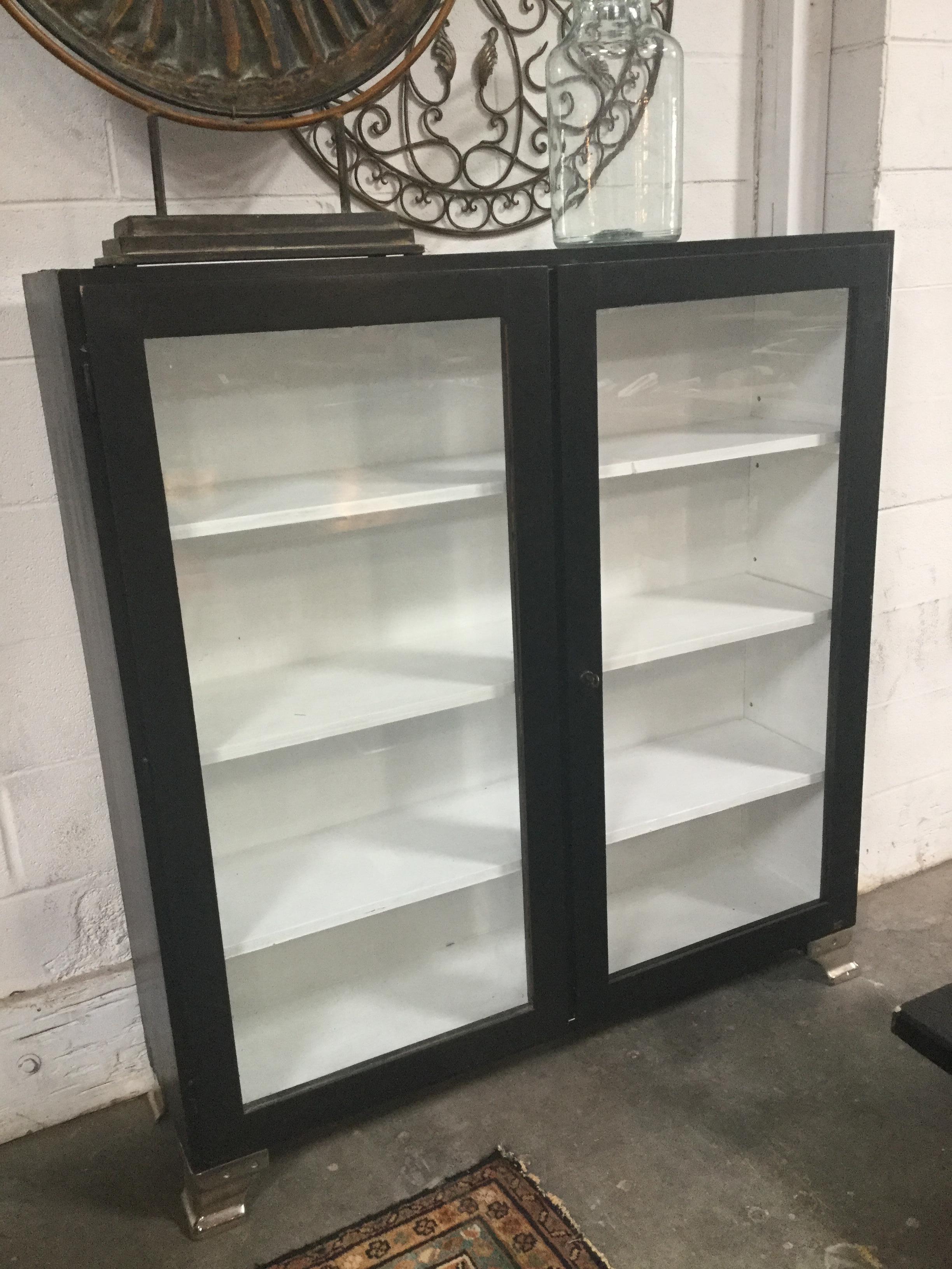 A beautiful vintage black and white cabinet. Simple and great for any space.