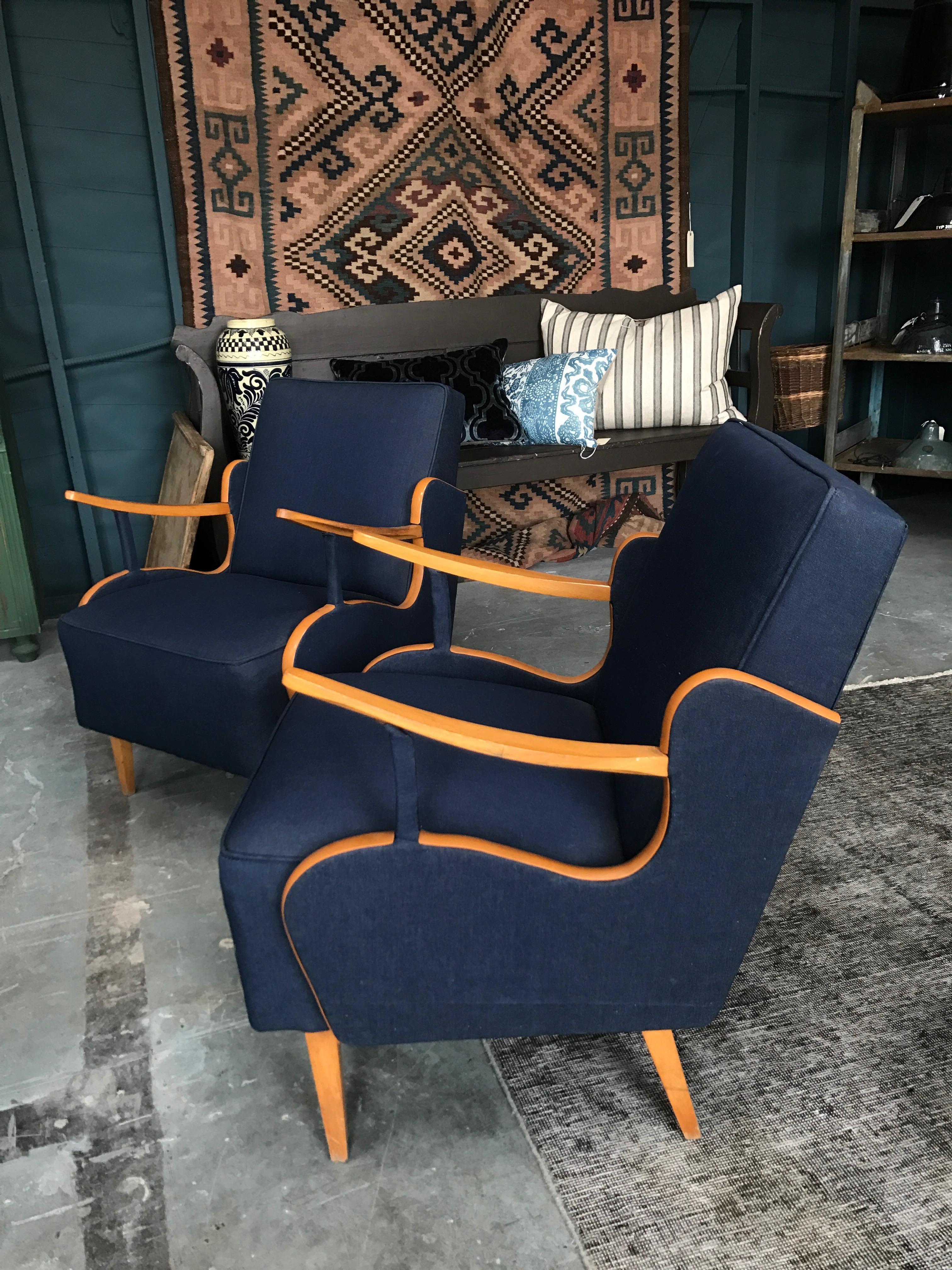 Pair of reupholstered vintage European chairs. Featuring blue fabric and a light stained wood. 

Measures: 24 W x 24 D x 31 H seat 17 H x 18 D.