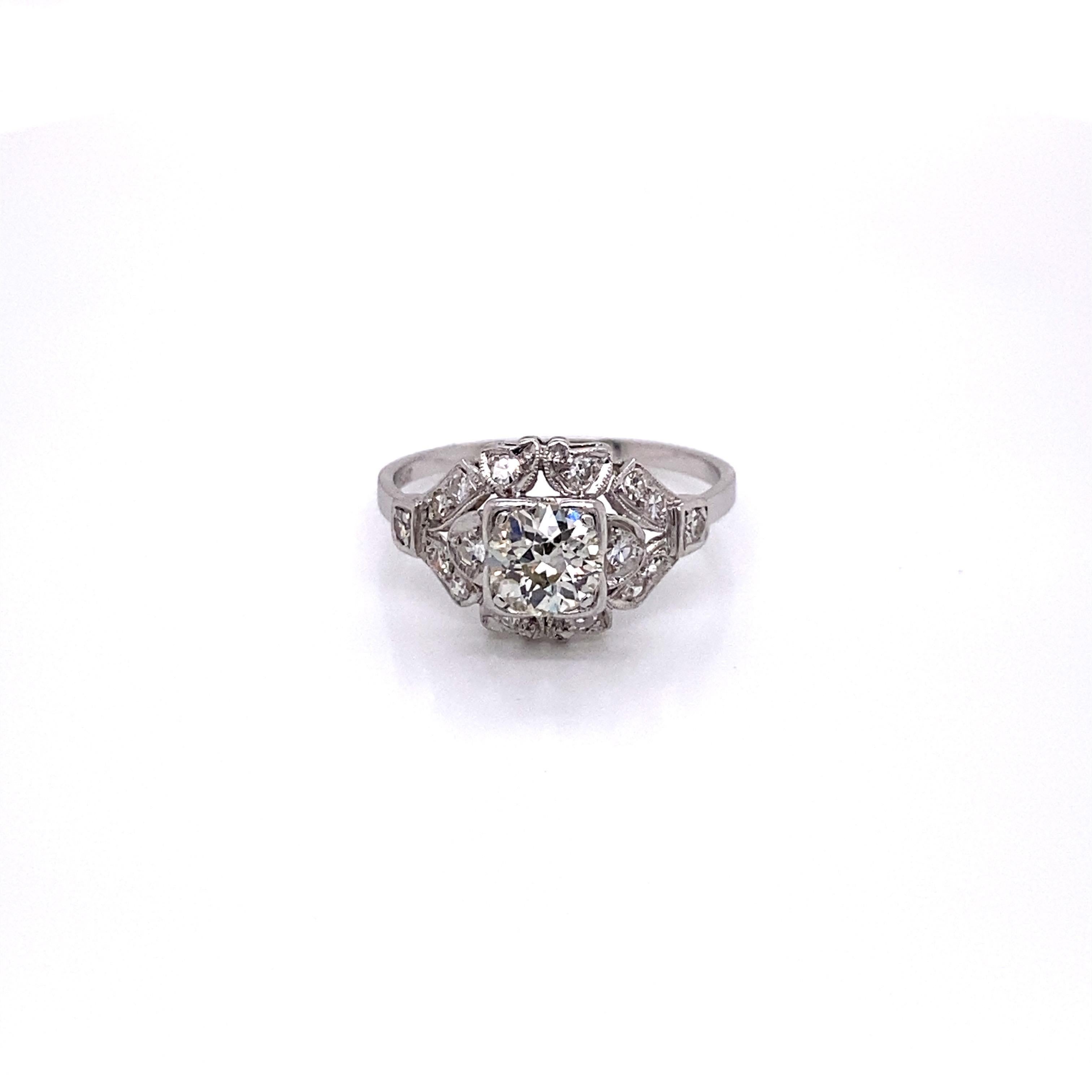 Vintage European Cut Diamond in Platinum Art Deco Ring - the center European cut diamond weighs .77ct with the quality of K color and VS2 clarity. The diamond sits low in a very detailed Art Deco platinum mounting with 16 single cut accent diamonds